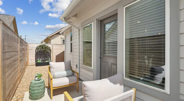 a view of a patio with couches chairs and potted plants