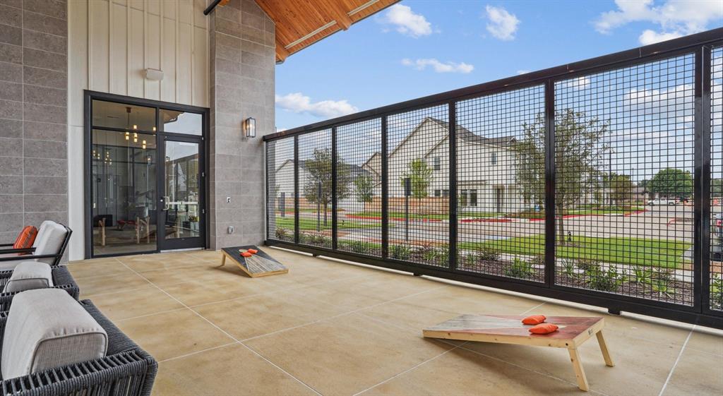 5725 Tanzanite Lane Fort Worth, TX 76123 - Photo 15 of 27 a view of a room with gym equipment and large windows