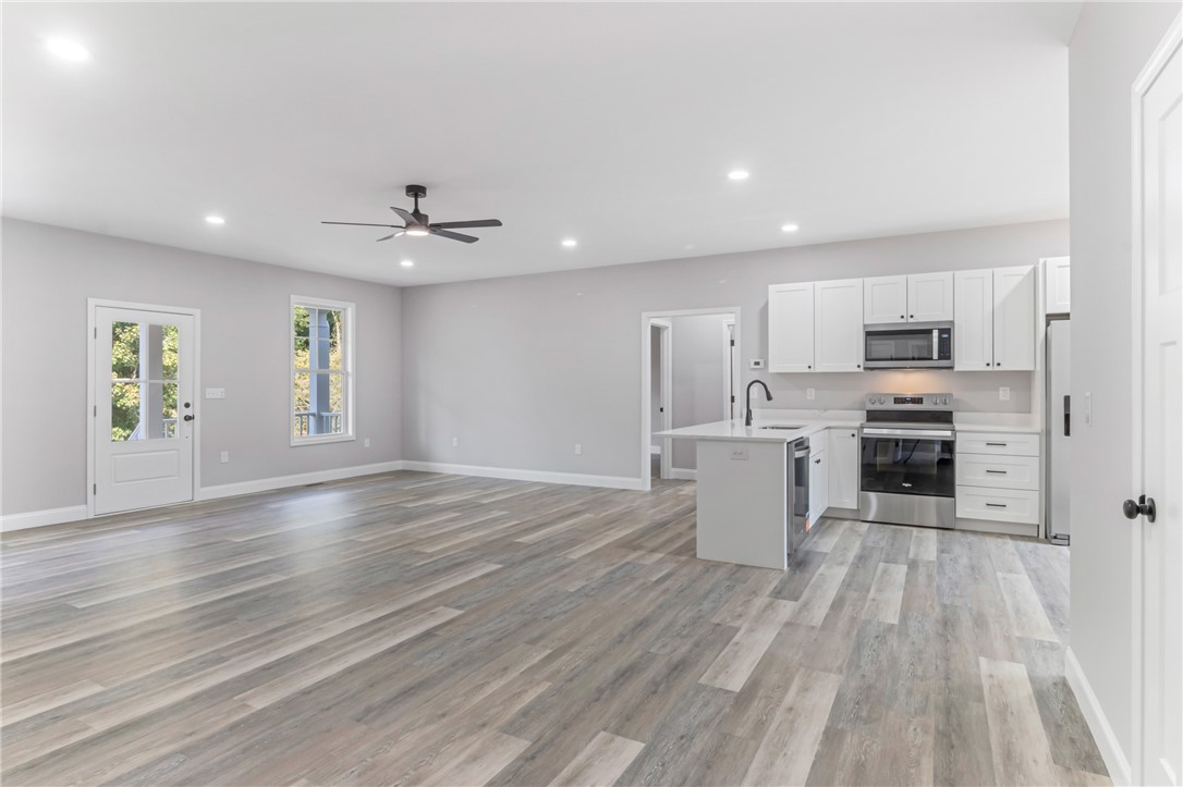 1115 Marshall Road Anderson, SC 29626 - Photo 9 of 35 Clean lines and smooth flooring define this versatile open living and dining area.