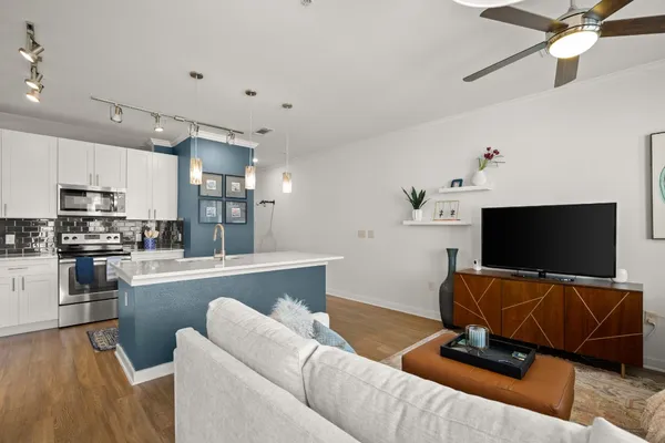 a living room with furniture and a flat screen tv