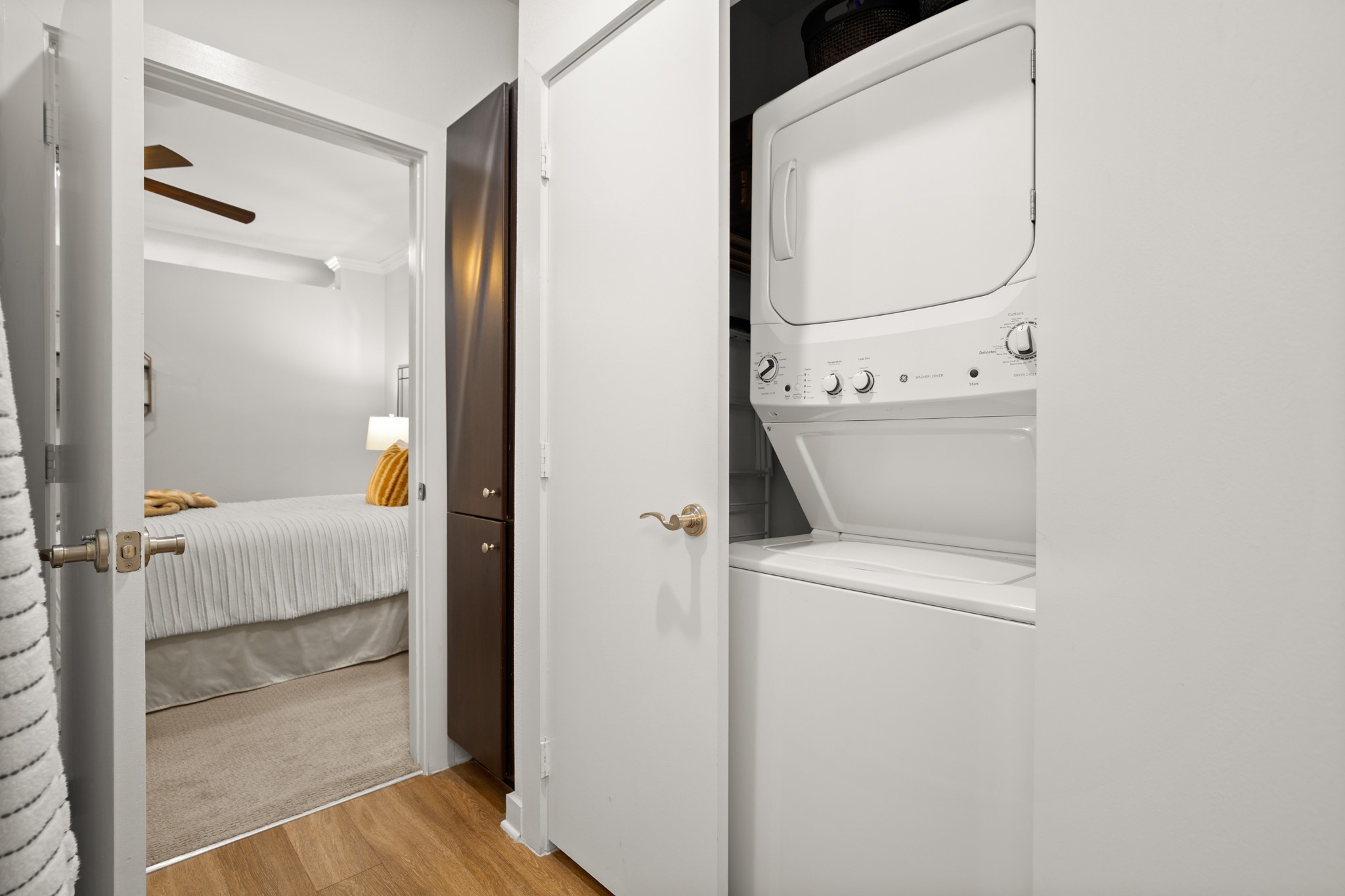 1900 Barton Springs Road, Unit 3038 Austin, TX 78704 - Photo 11 of 38 Stackable washer and dryer in closet in bathroom
