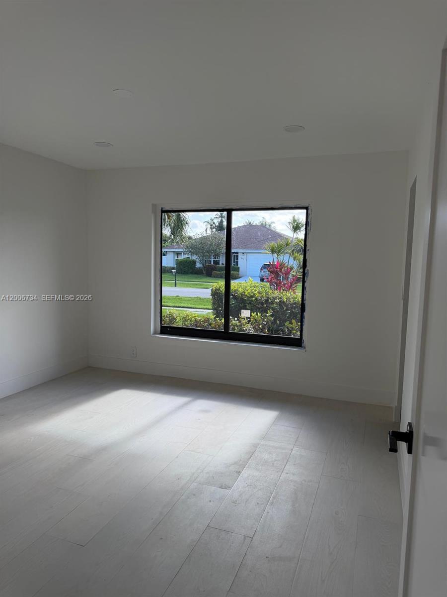7917 Chula Vista Crescent Boca Raton, FL 33433 - Photo 11 of 28 a view of an empty room with a window