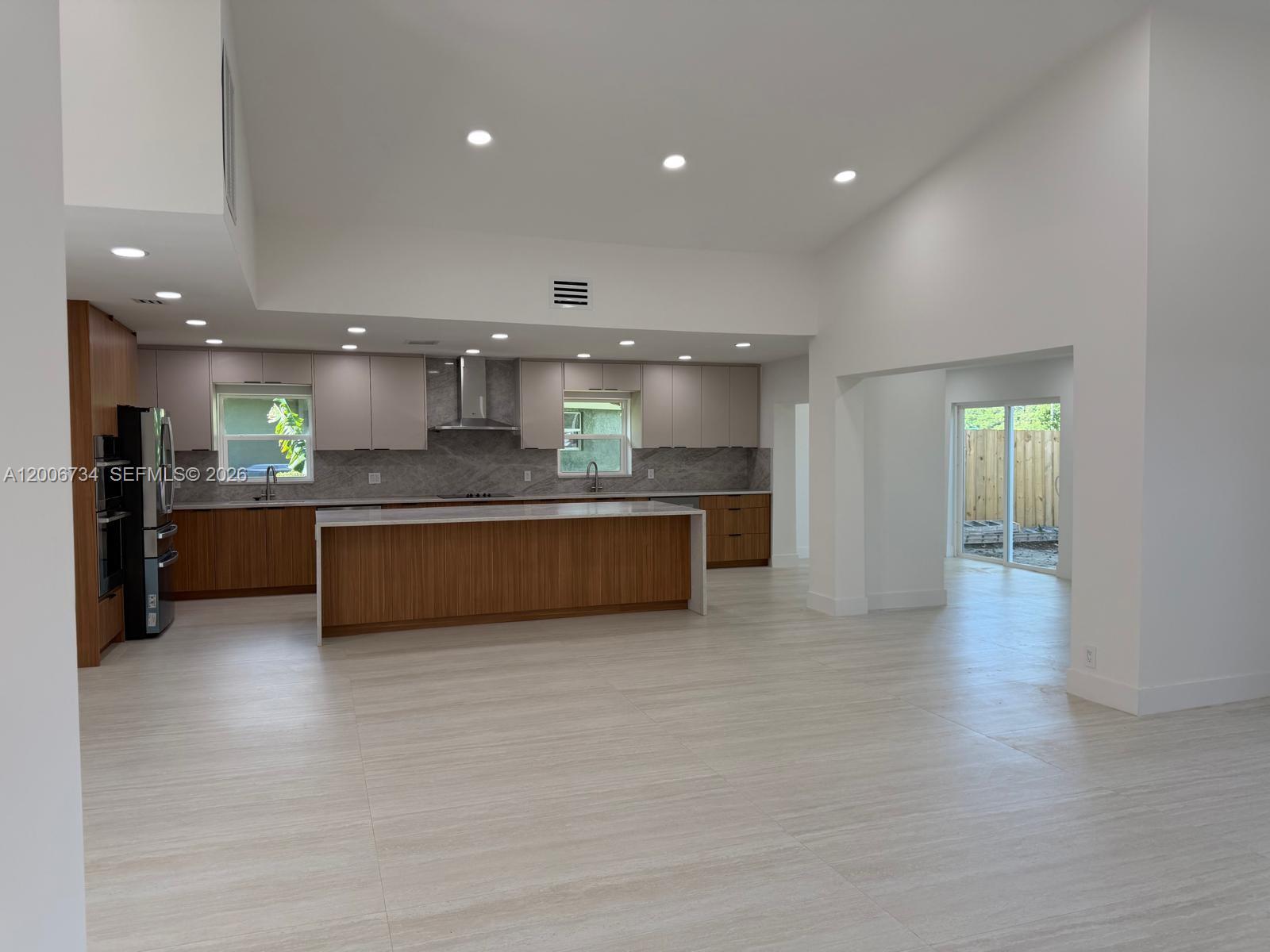 7917 Chula Vista Crescent Boca Raton, FL 33433 - Photo 2 of 28 a large kitchen with a lot of counter top space and stainless steel appliances
