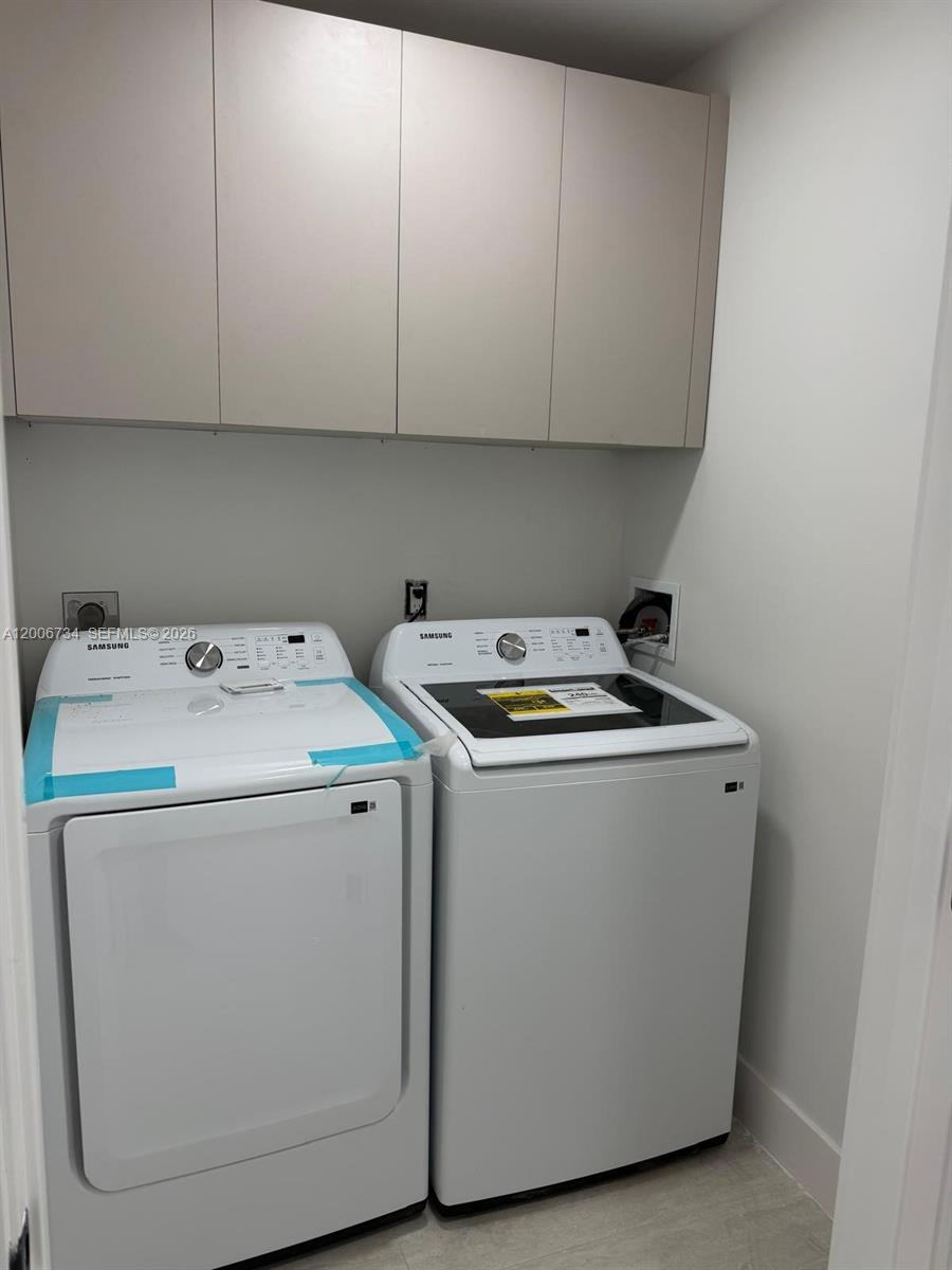 7917 Chula Vista Crescent Boca Raton, FL 33433 - Photo 23 of 28 a utility room with dryer and washer