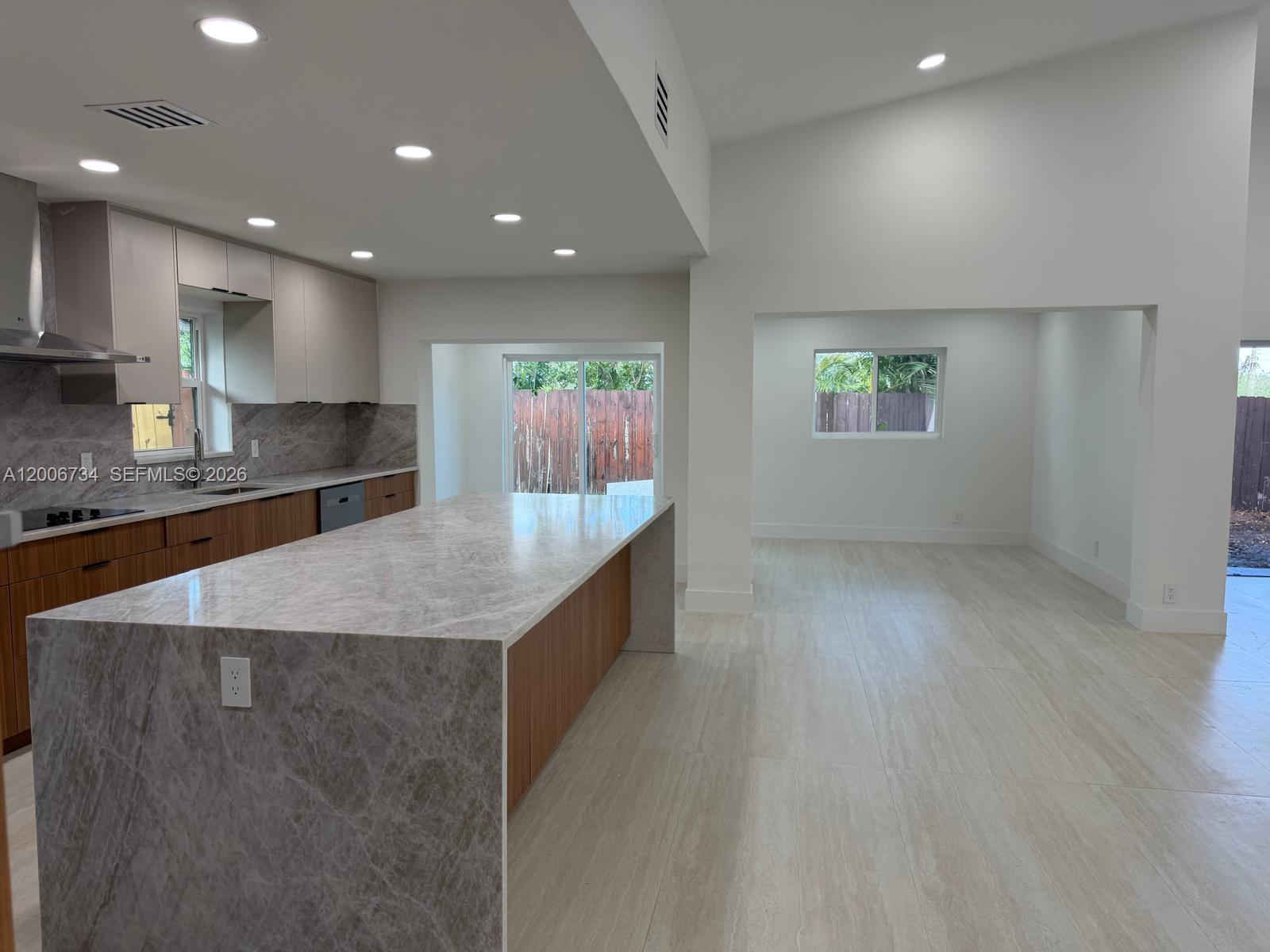 7917 Chula Vista Crescent Boca Raton, FL 33433 - Photo 4 of 28 a large kitchen with stainless steel appliances a large counter top