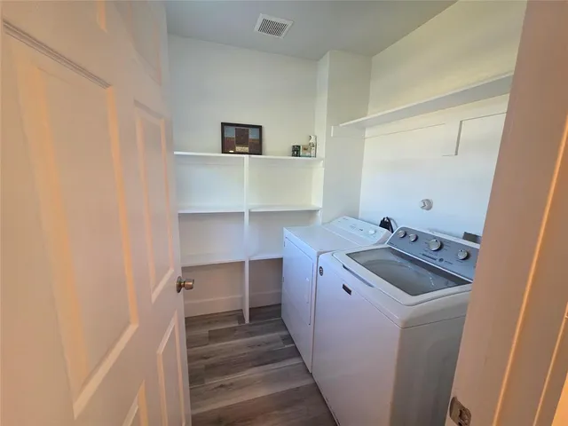 a room with a sink and a mirror