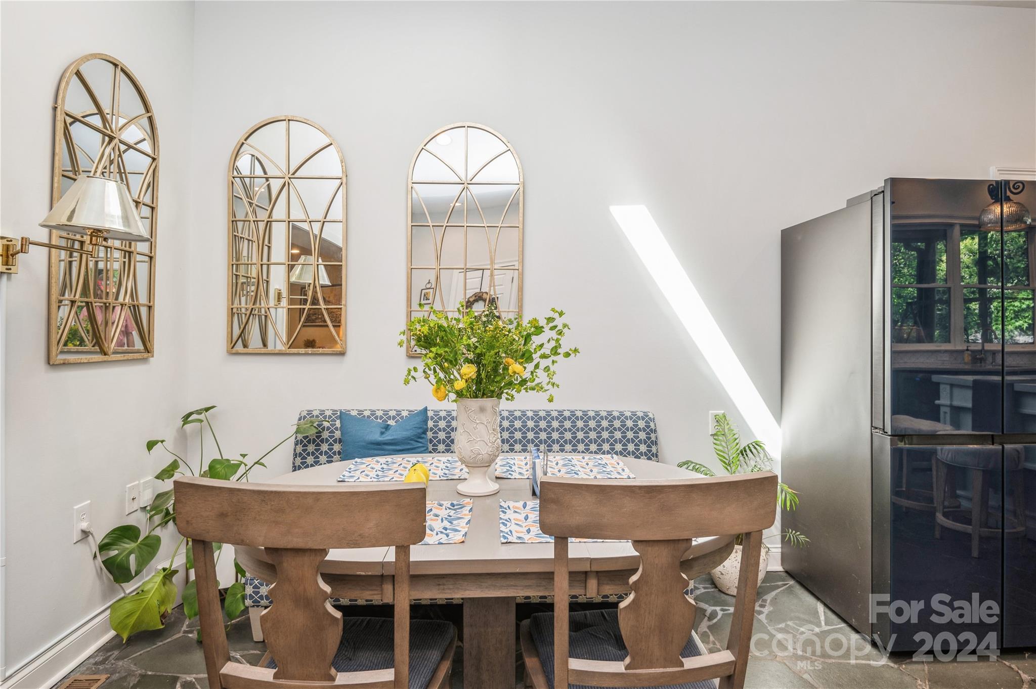 4027 Rutherford Drive Charlotte, NC 28210 - Photo 11 of 48 a view of a dining room with furniture window and wooden floor