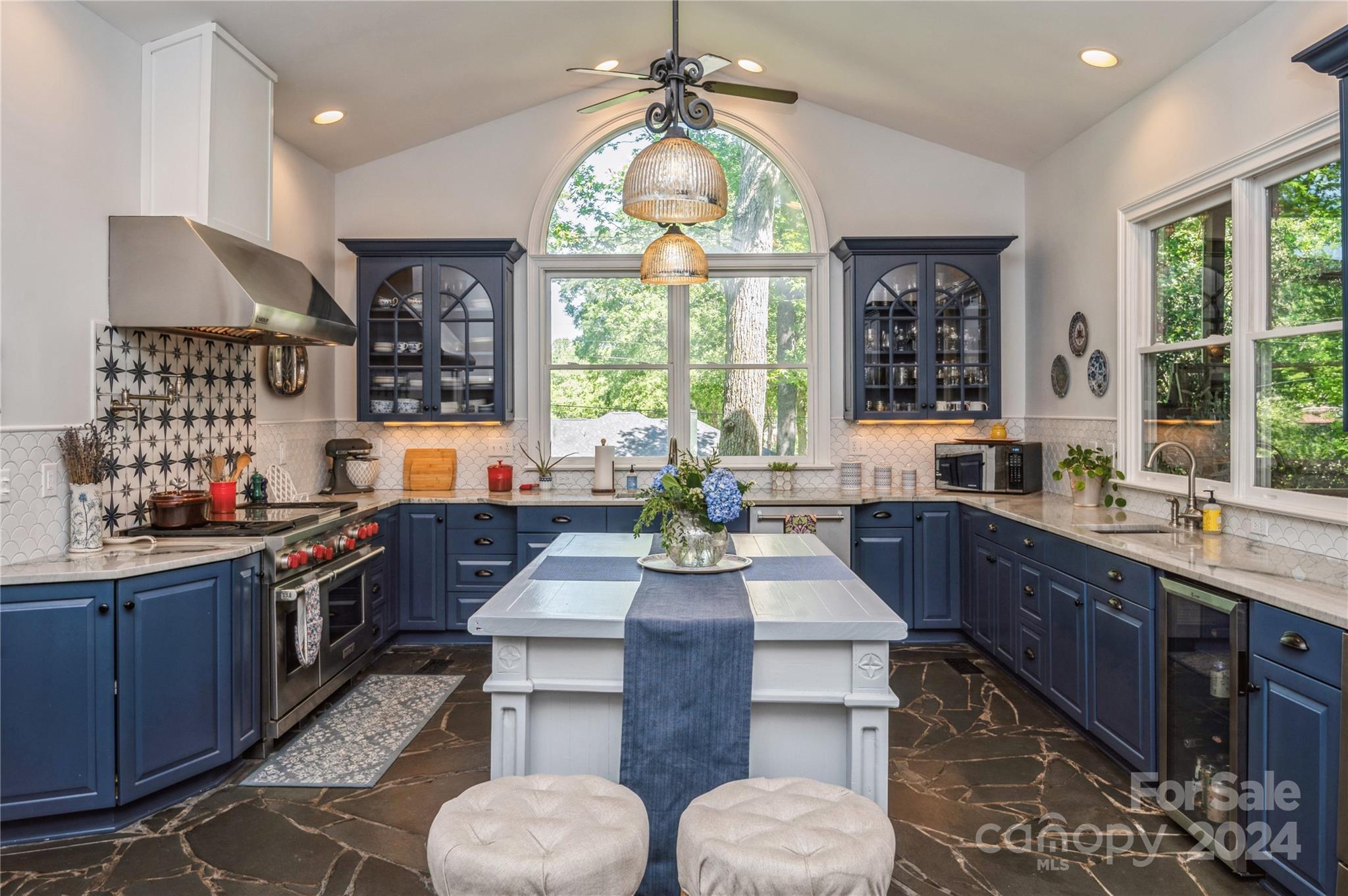4027 Rutherford Drive Charlotte, NC 28210 - Photo 14 of 48 a large kitchen with granite countertop a sink and a stove