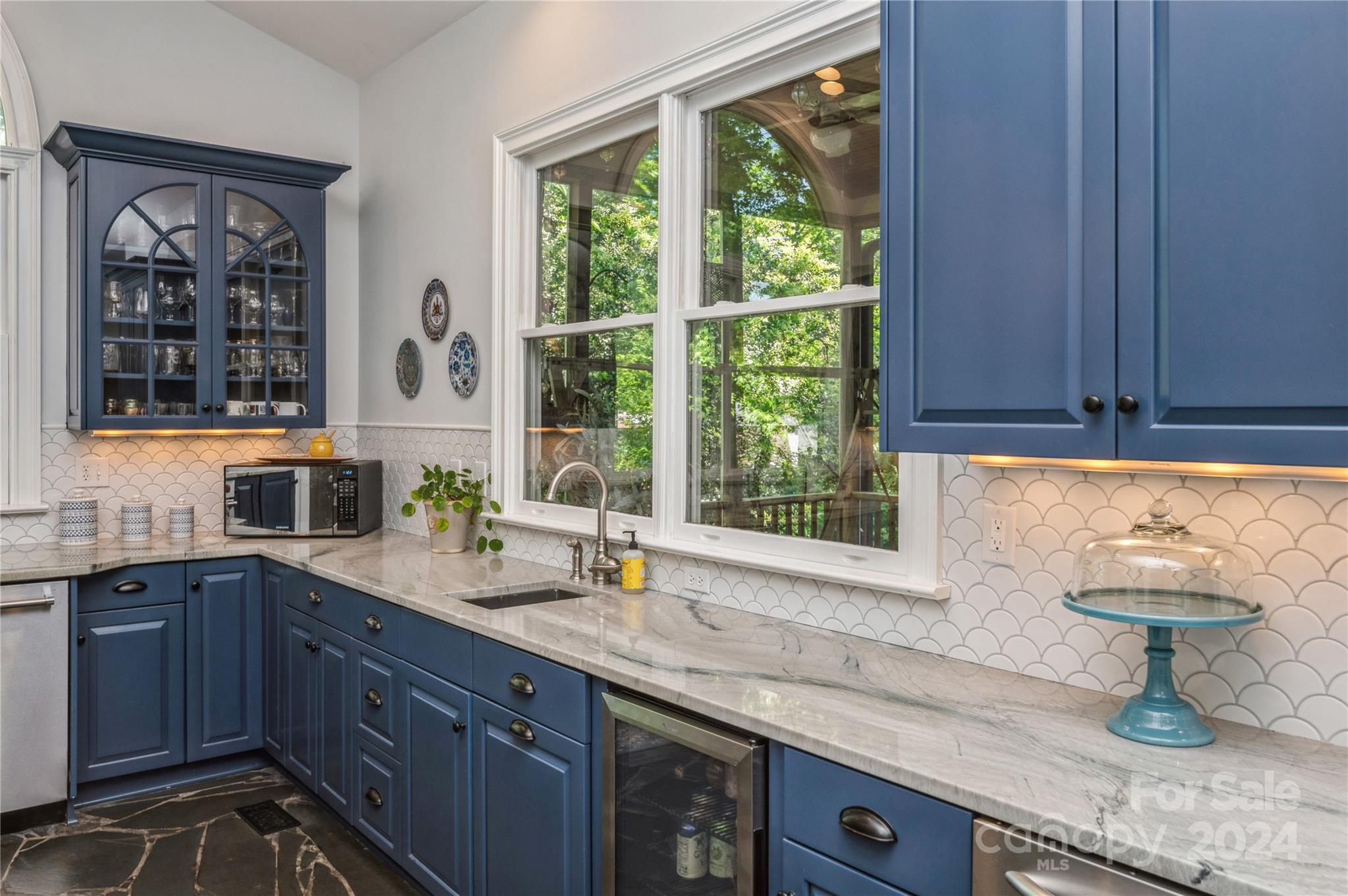4027 Rutherford Drive Charlotte, NC 28210 - Photo 15 of 48 a kitchen with a sink and large window