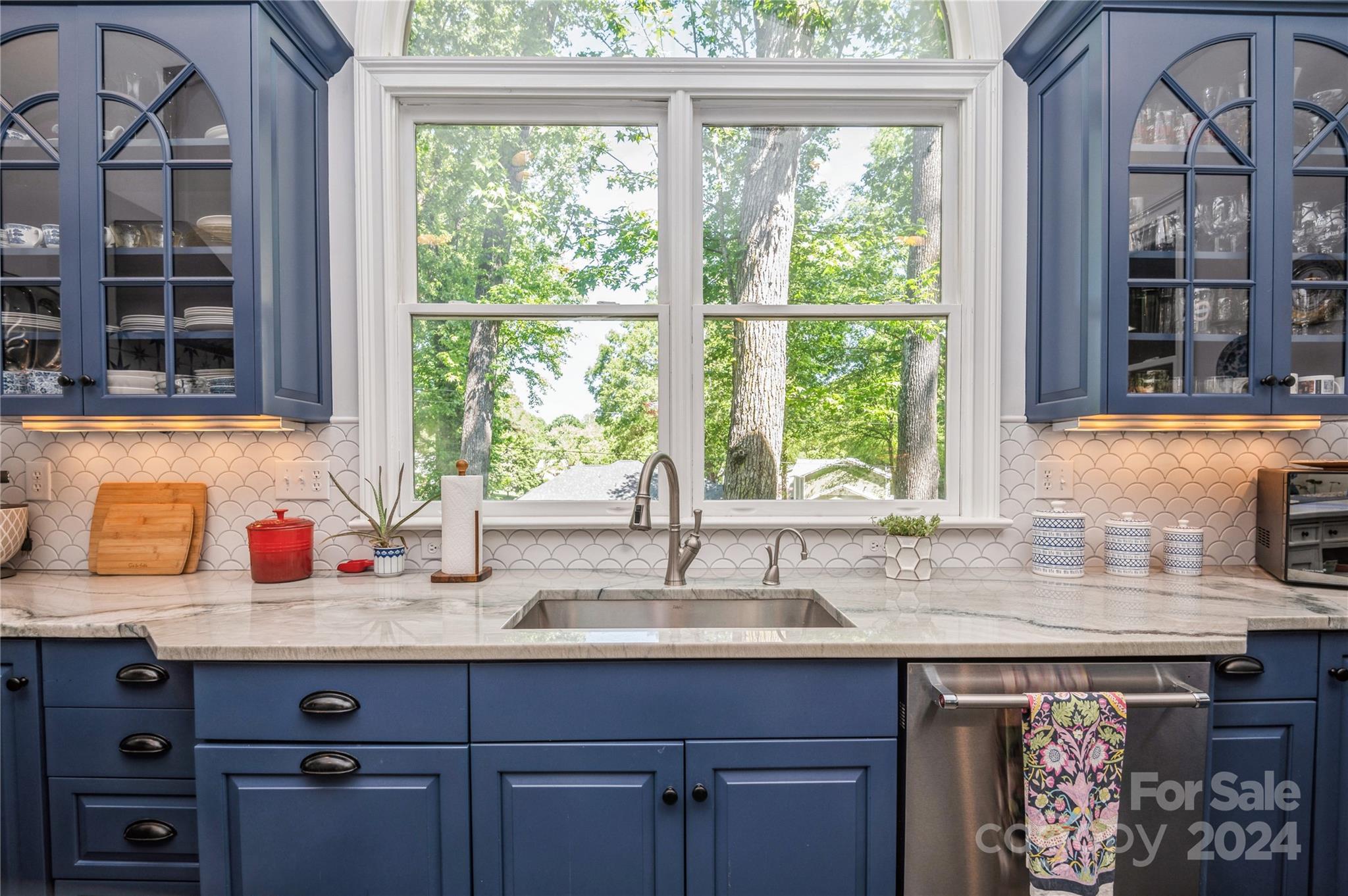 4027 Rutherford Drive Charlotte, NC 28210 - Photo 17 of 48 a kitchen with granite countertop a sink and a window