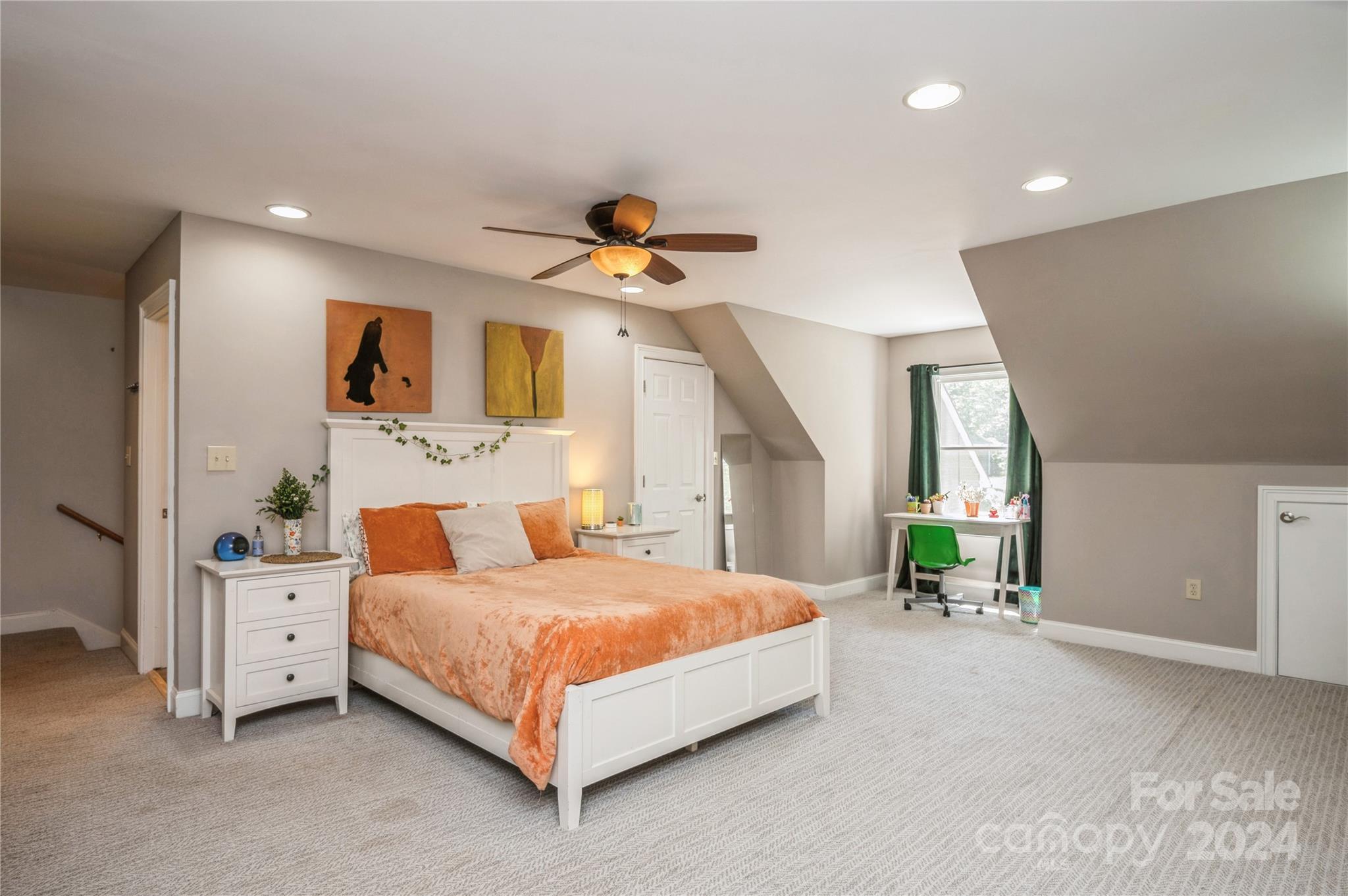 4027 Rutherford Drive Charlotte, NC 28210 - Photo 21 of 48 a bedroom with a bed a window and a chandelier