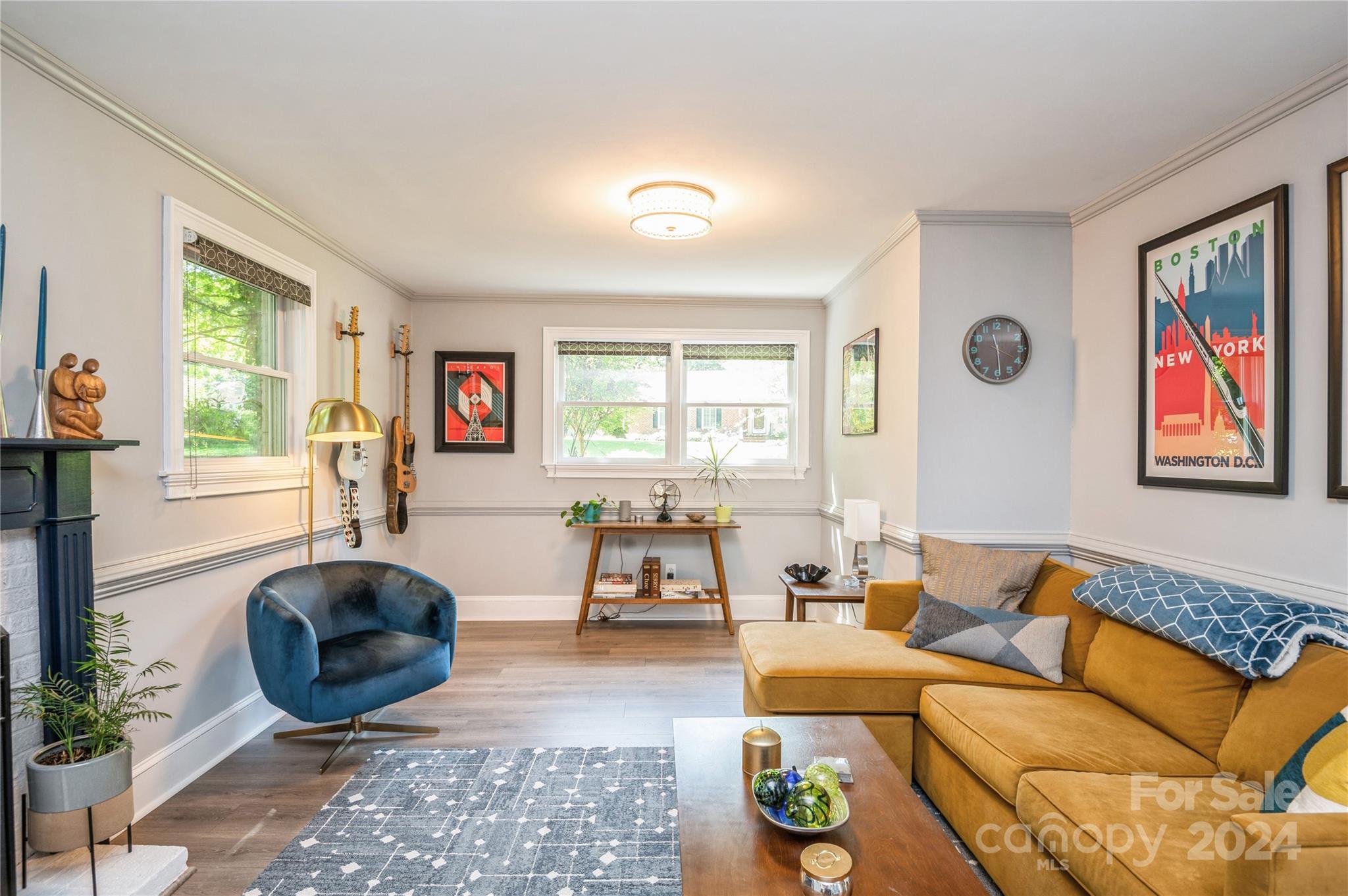 4027 Rutherford Drive Charlotte, NC 28210 - Photo 25 of 48 a living room with furniture a chandelier and a large window