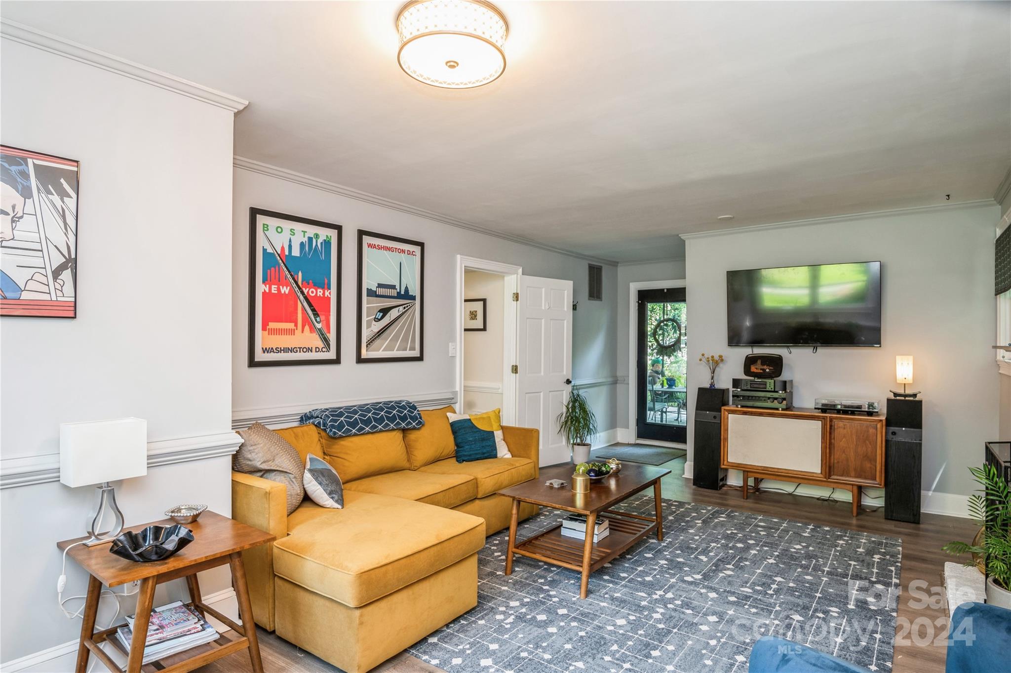4027 Rutherford Drive Charlotte, NC 28210 - Photo 27 of 48 a living room with furniture and a flat screen tv