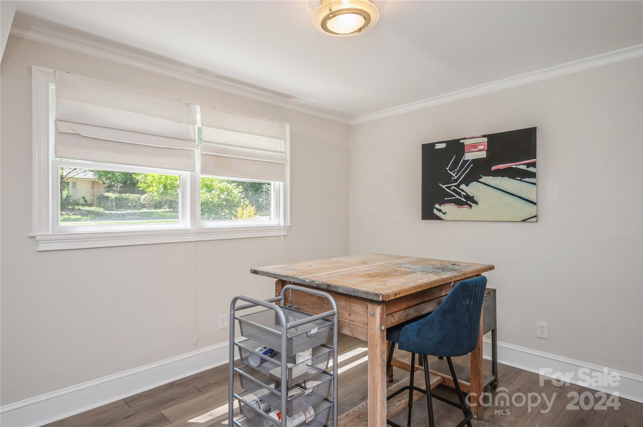 4027 Rutherford Drive Charlotte, NC 28210 - Photo 28 of 48 a dining room with a table and chairs