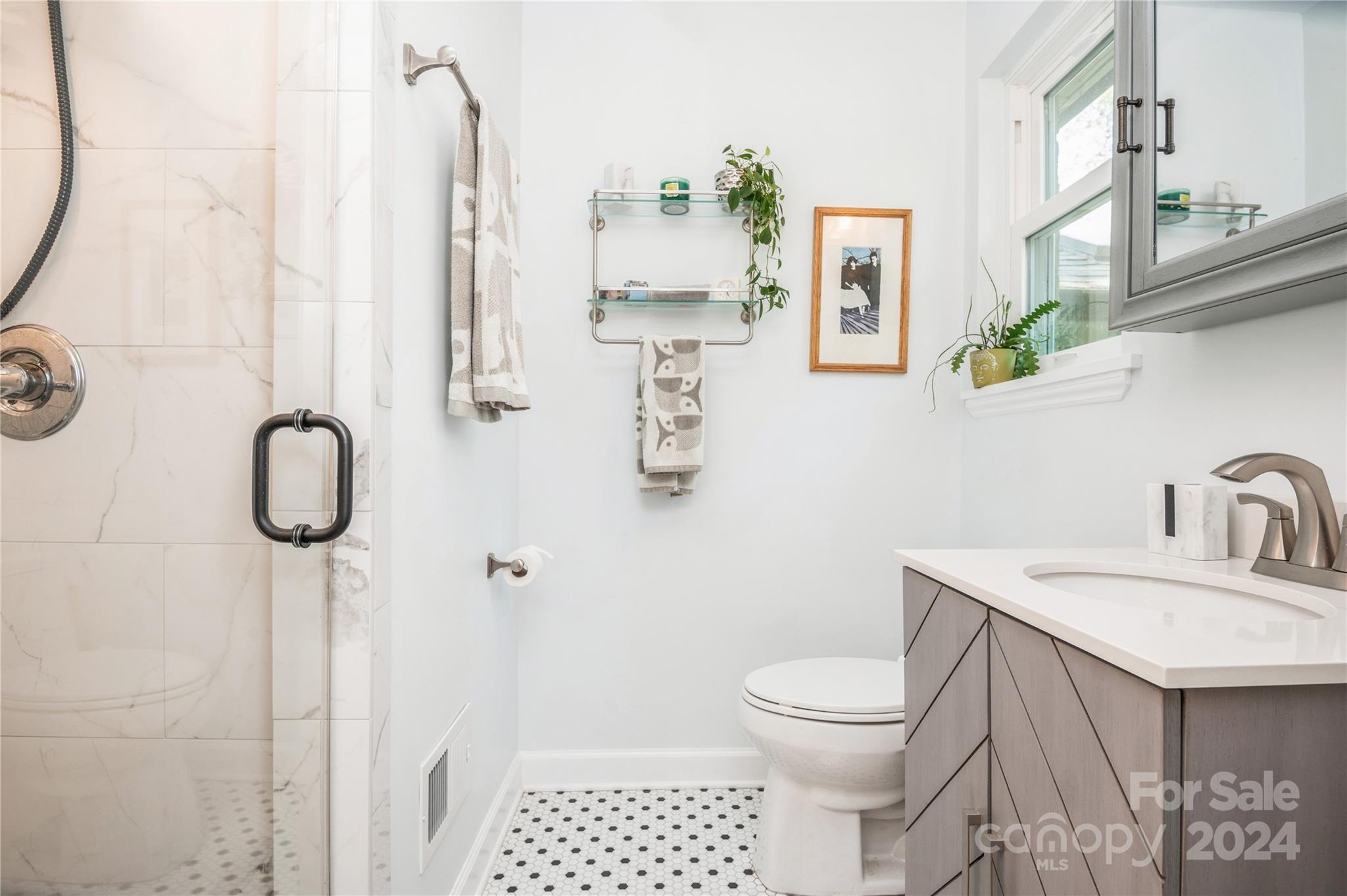 4027 Rutherford Drive Charlotte, NC 28210 - Photo 32 of 48 a bathroom with a sink toilet and shower