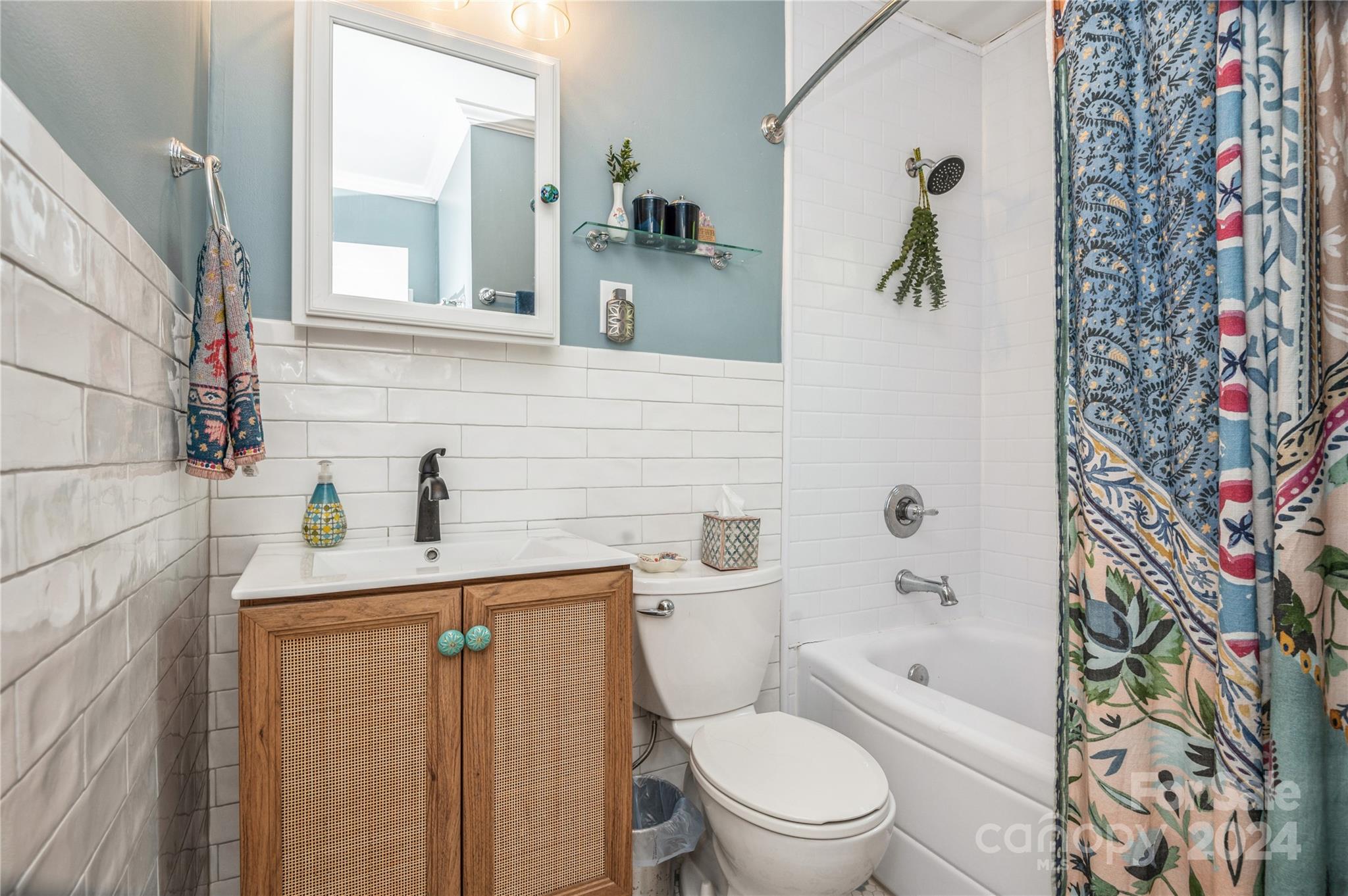 4027 Rutherford Drive Charlotte, NC 28210 - Photo 34 of 48 a bathroom with a sink toilet and shower