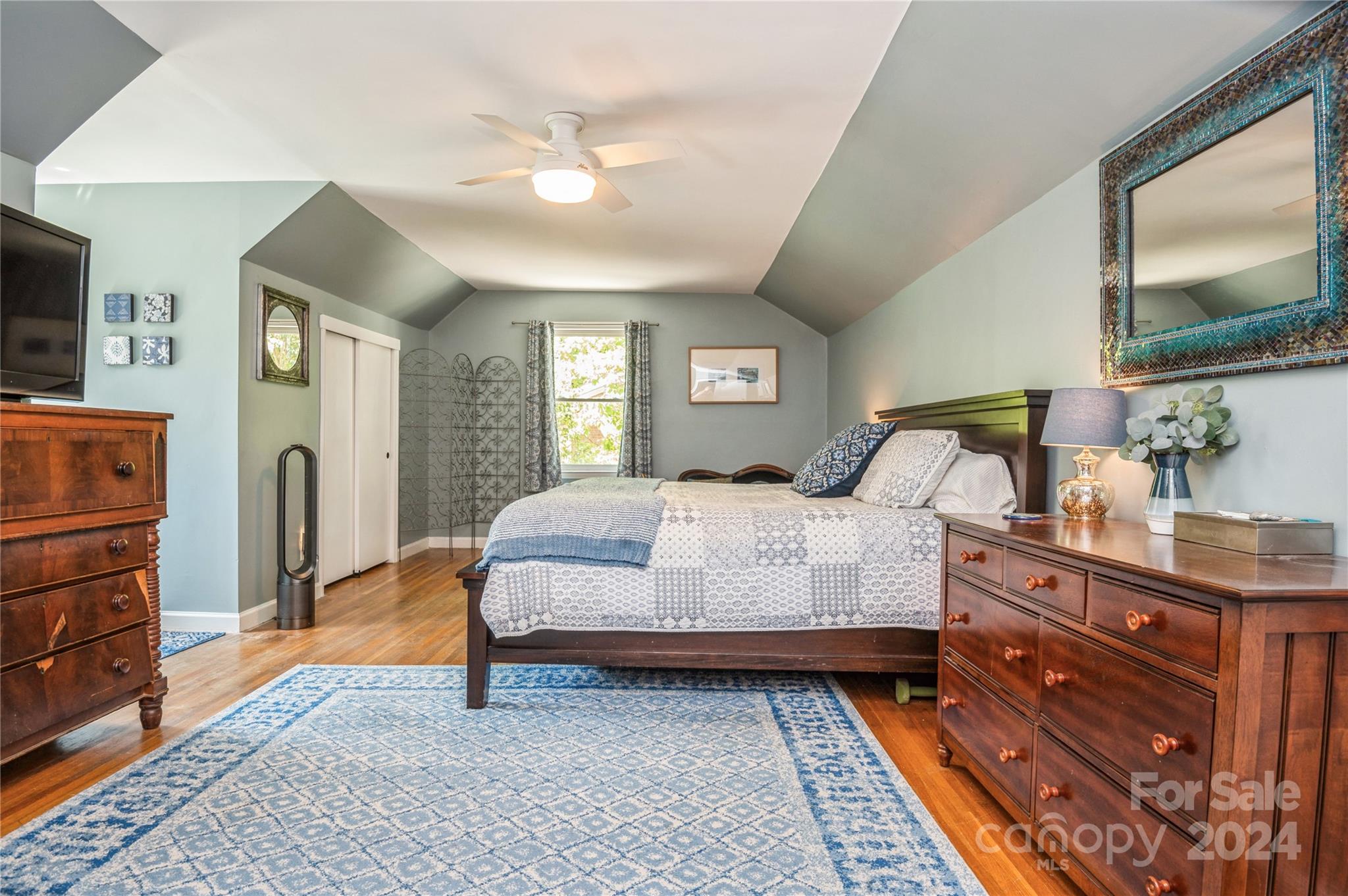 4027 Rutherford Drive Charlotte, NC 28210 - Photo 36 of 48 a bedroom with a bed and a mirror on dresser