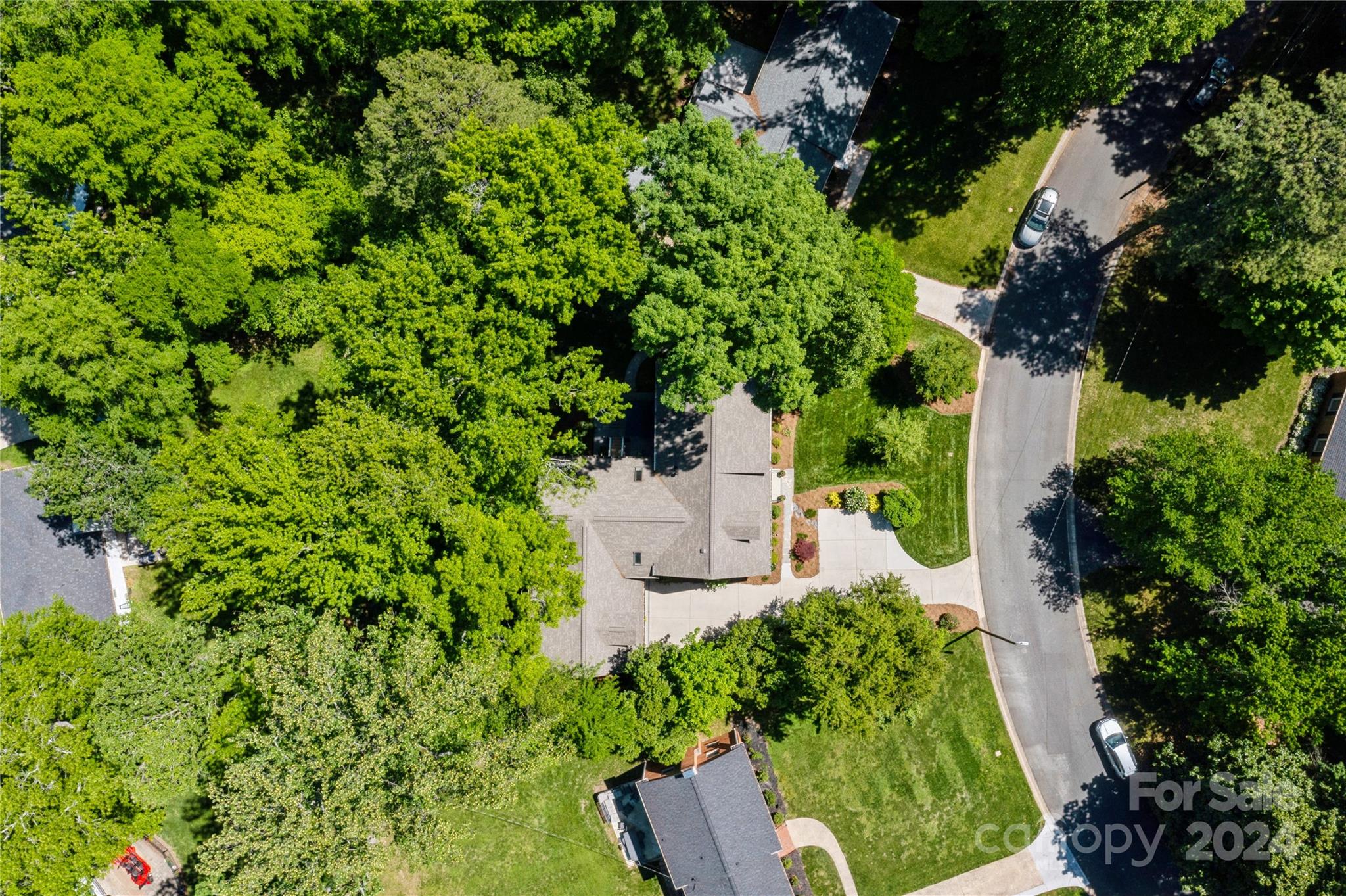 4027 Rutherford Drive Charlotte, NC 28210 - Photo 44 of 48 an aerial view of a house with a yard and garden