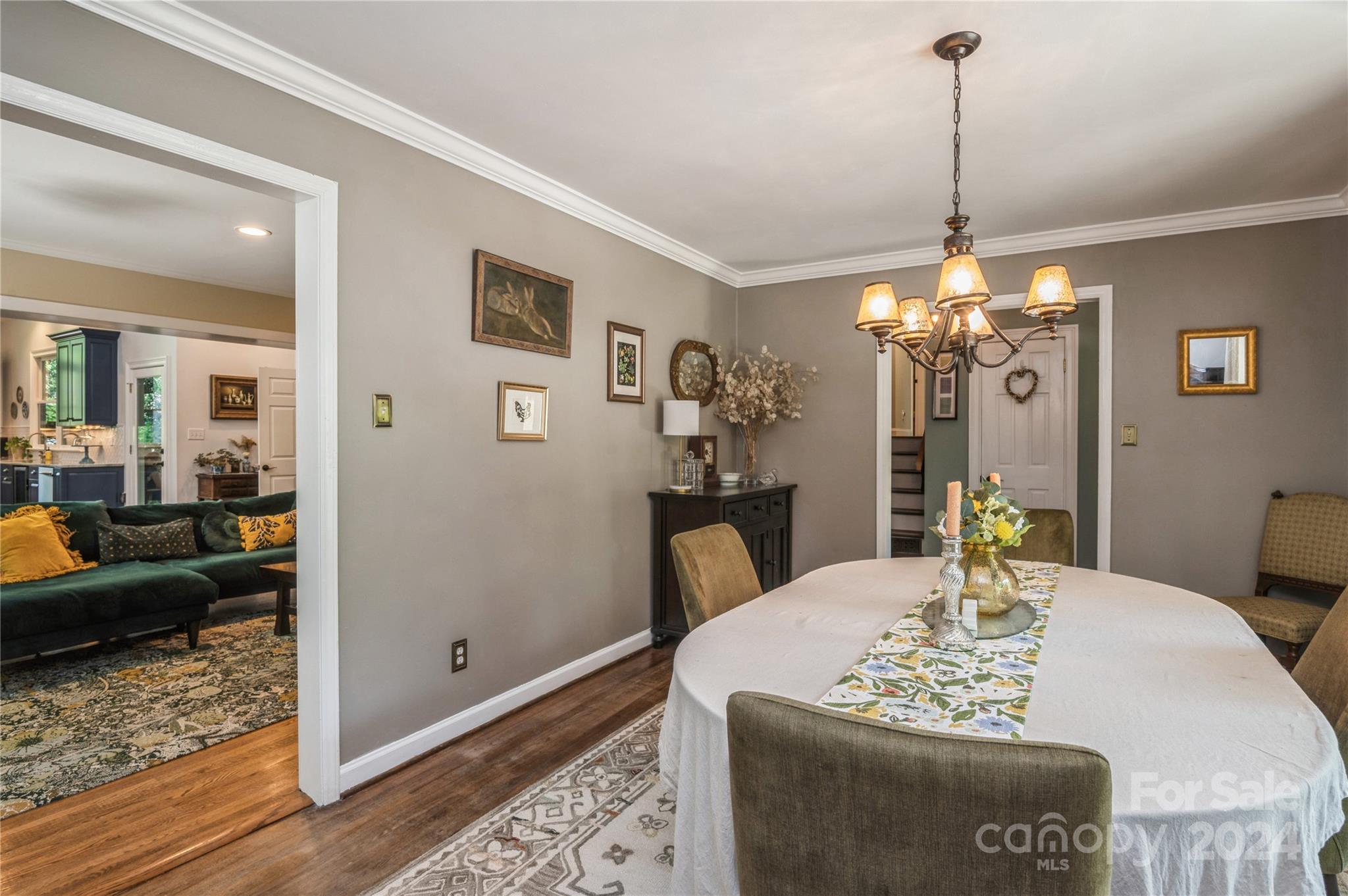 4027 Rutherford Drive Charlotte, NC 28210 - Photo 5 of 48 a living room with furniture and a chandelier