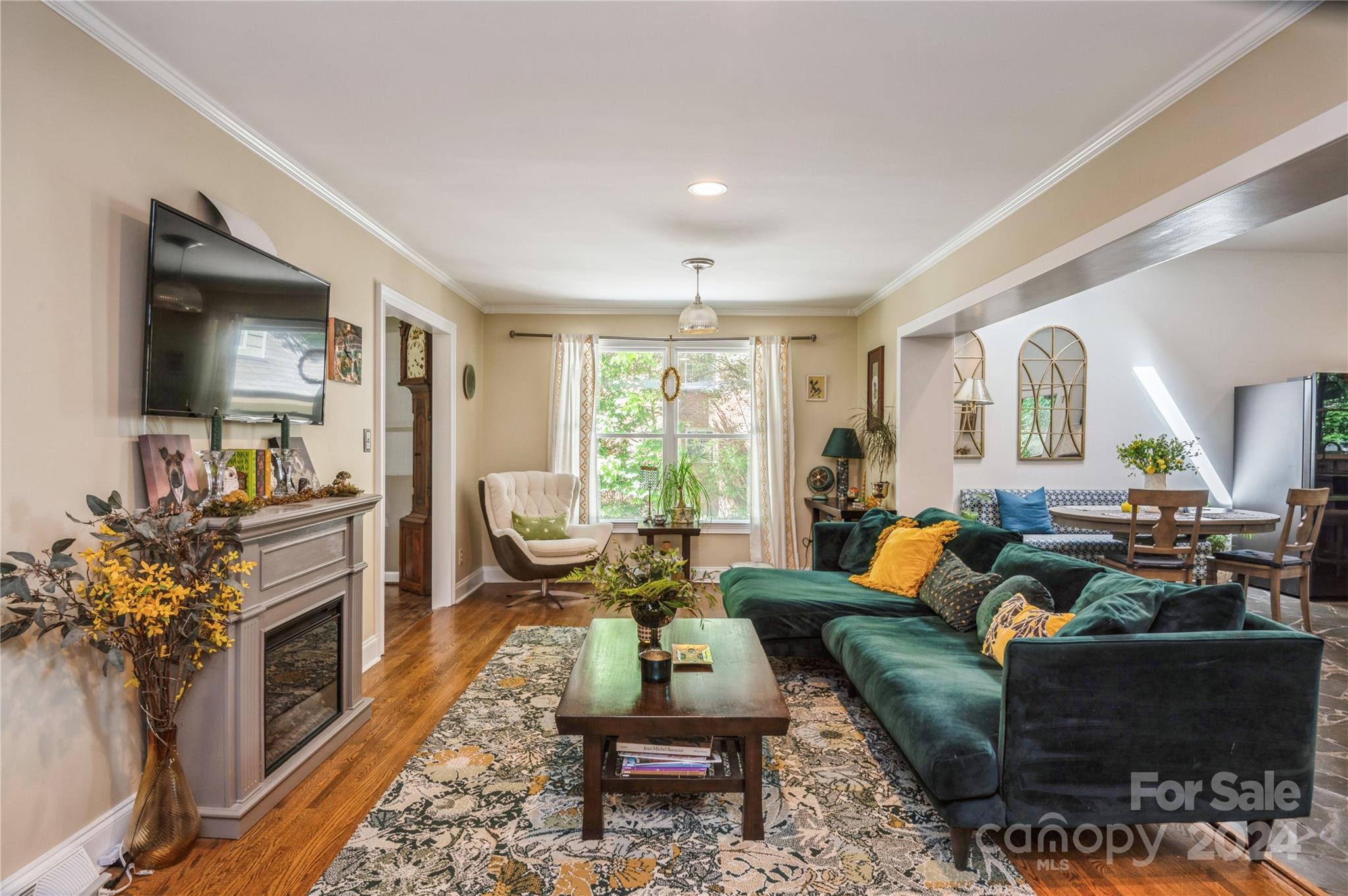 4027 Rutherford Drive Charlotte, NC 28210 - Photo 7 of 48 a living room with furniture a fireplace and a flat screen tv