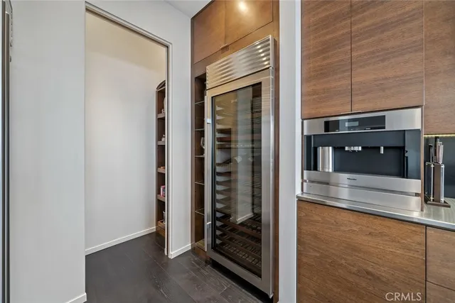 a bedroom with a large bed and a large window