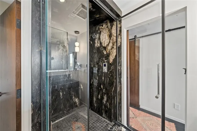 a view of city from balcony with seating space