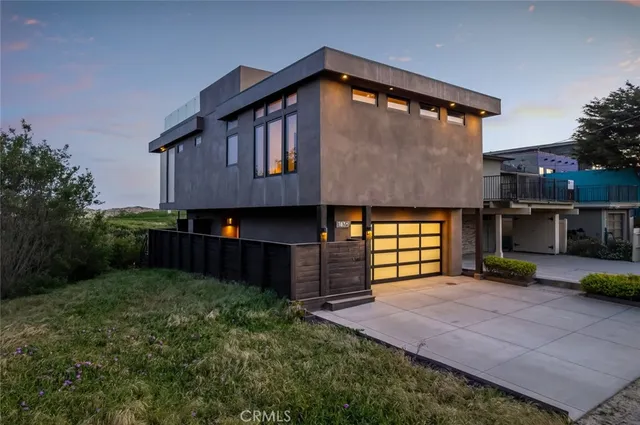 an aerial view of a house with big yard