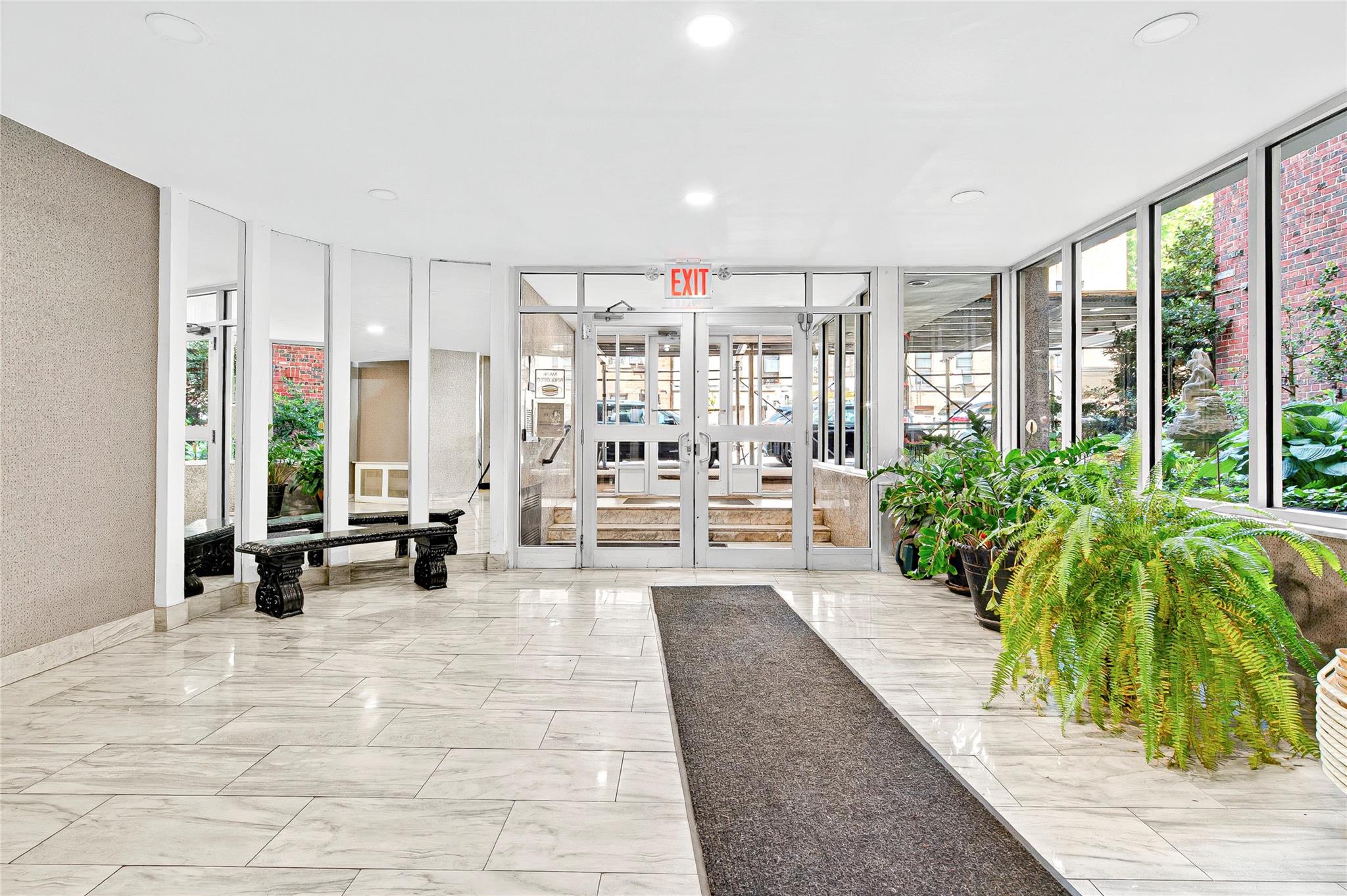 3176 Decatur Avenue, Unit 1I Bronx, NY 10467 - Photo 2 of 16 Building lobby with expansive windows