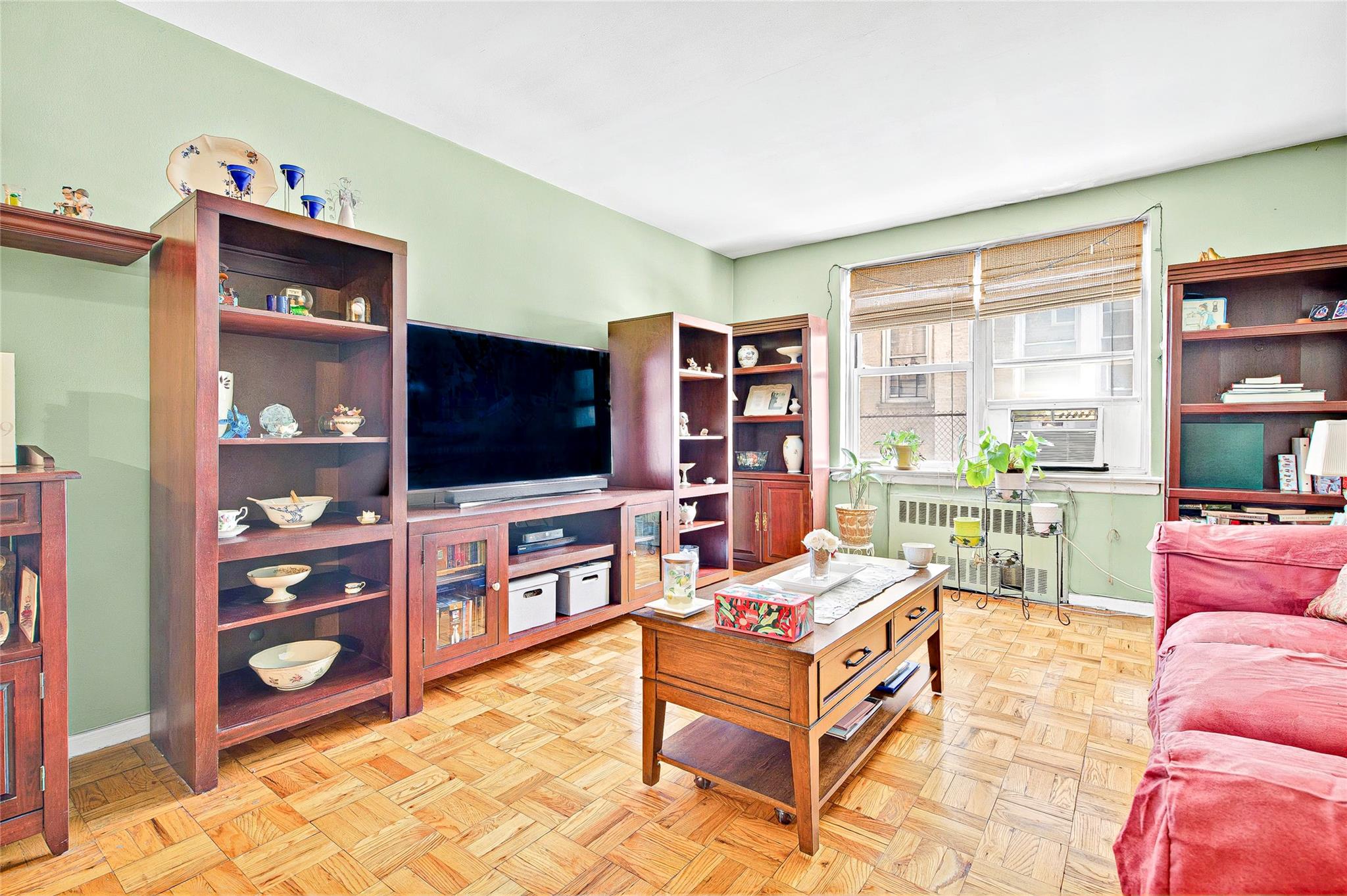 3176 Decatur Avenue, Unit 1I Bronx, NY 10467 - Photo 7 of 16 Living room featuring radiator and baseboards