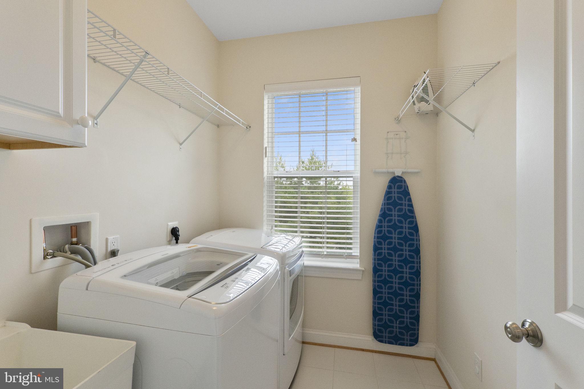23902 Grapevine Ridge Terrace Clarksburg, MD 20871 - Photo 24 of 44 a view of washer and dryer