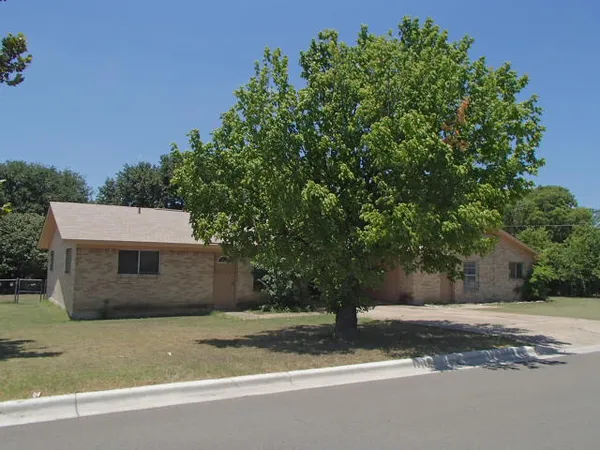 a house with trees in the background