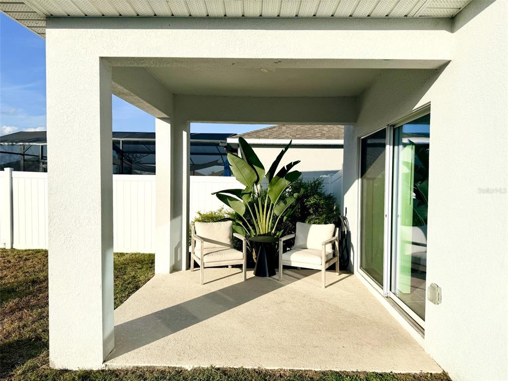1126 Calico Pointe Circle Groveland, FL 34736 - Photo 19 of 28 a view of potted plant in front of a door