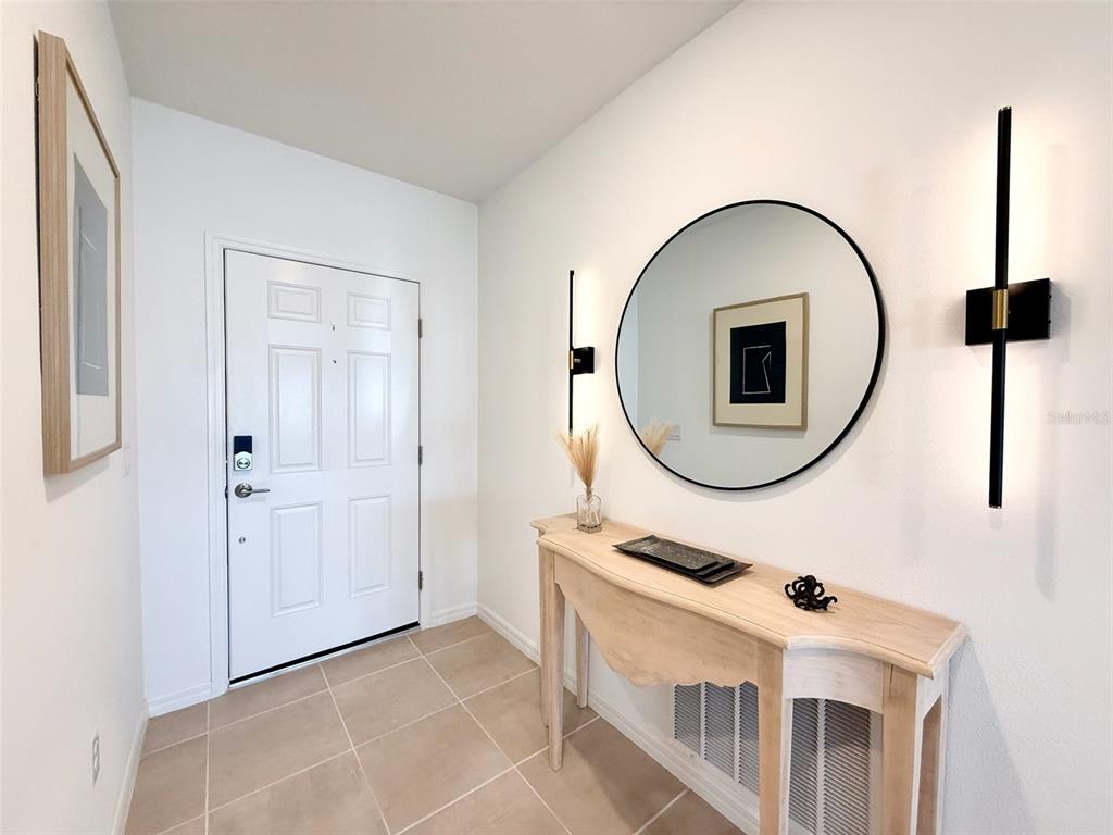1126 Calico Pointe Circle Groveland, FL 34736 - Photo 3 of 28 a bathroom with a sink a mirror and a window