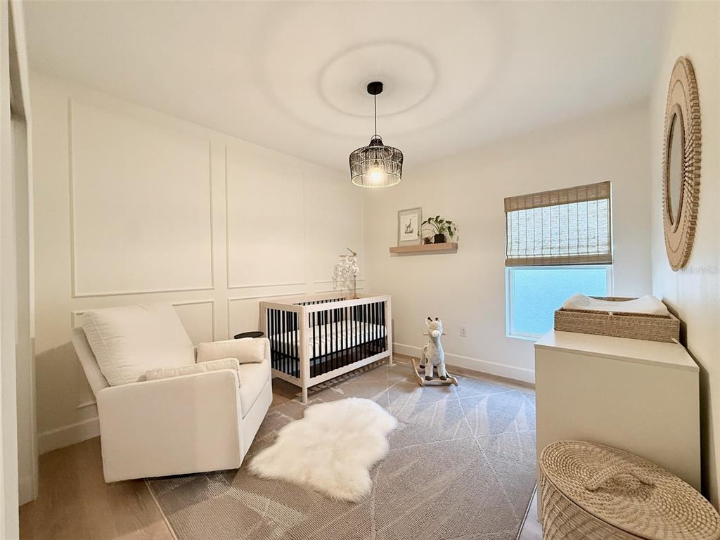 1126 Calico Pointe Circle Groveland, FL 34736 - Photo 5 of 28 a bedroom with furniture and a window