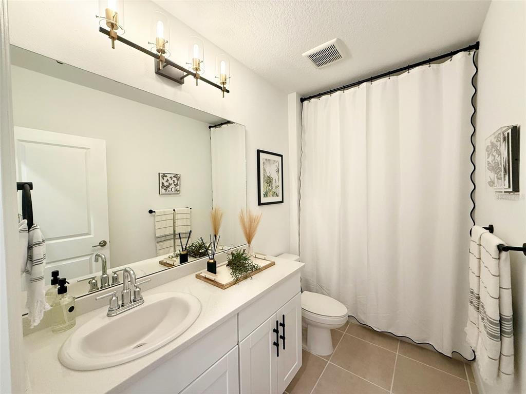1126 Calico Pointe Circle Groveland, FL 34736 - Photo 6 of 28 a bathroom with a sink toilet and shower