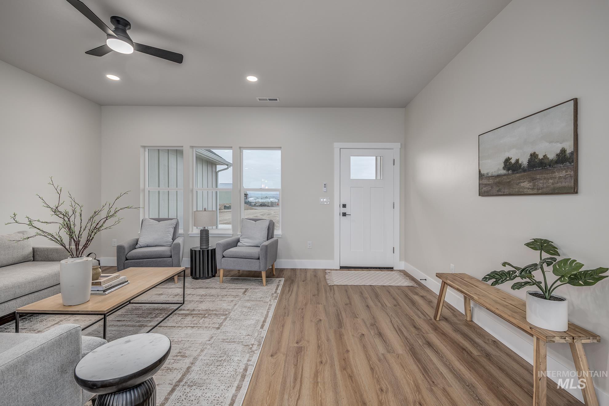 1367 Hansen Road Weiser, ID 83672 - Photo 2 of 36 Living room featuring a ceiling fan, light wood finished floors, and recessed lighting