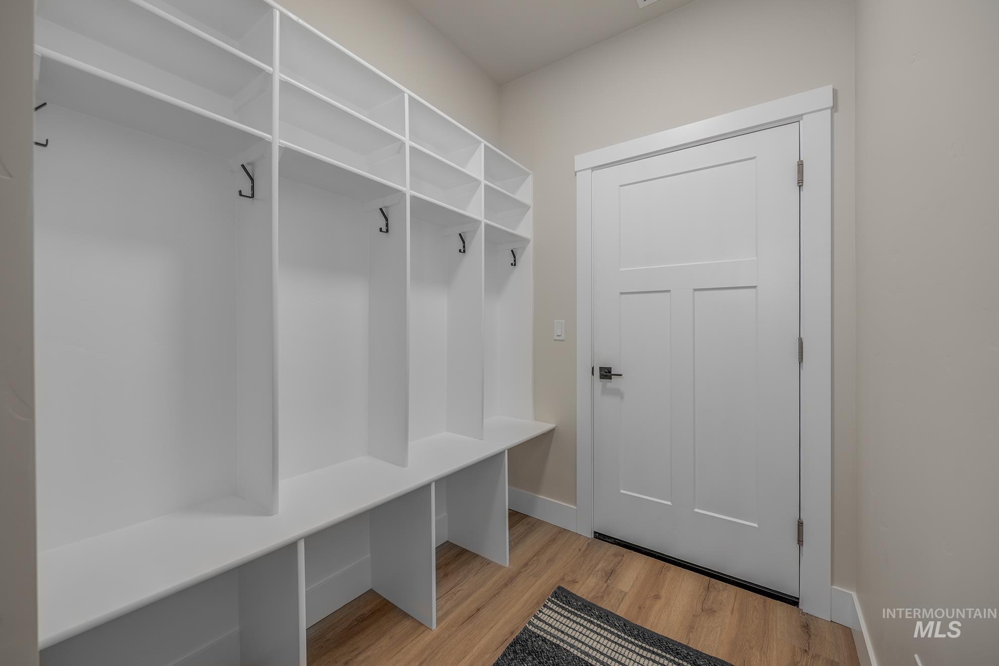 1367 Hansen Road Weiser, ID 83672 - Photo 23 of 36 Mudroom featuring light wood-style flooring and baseboards