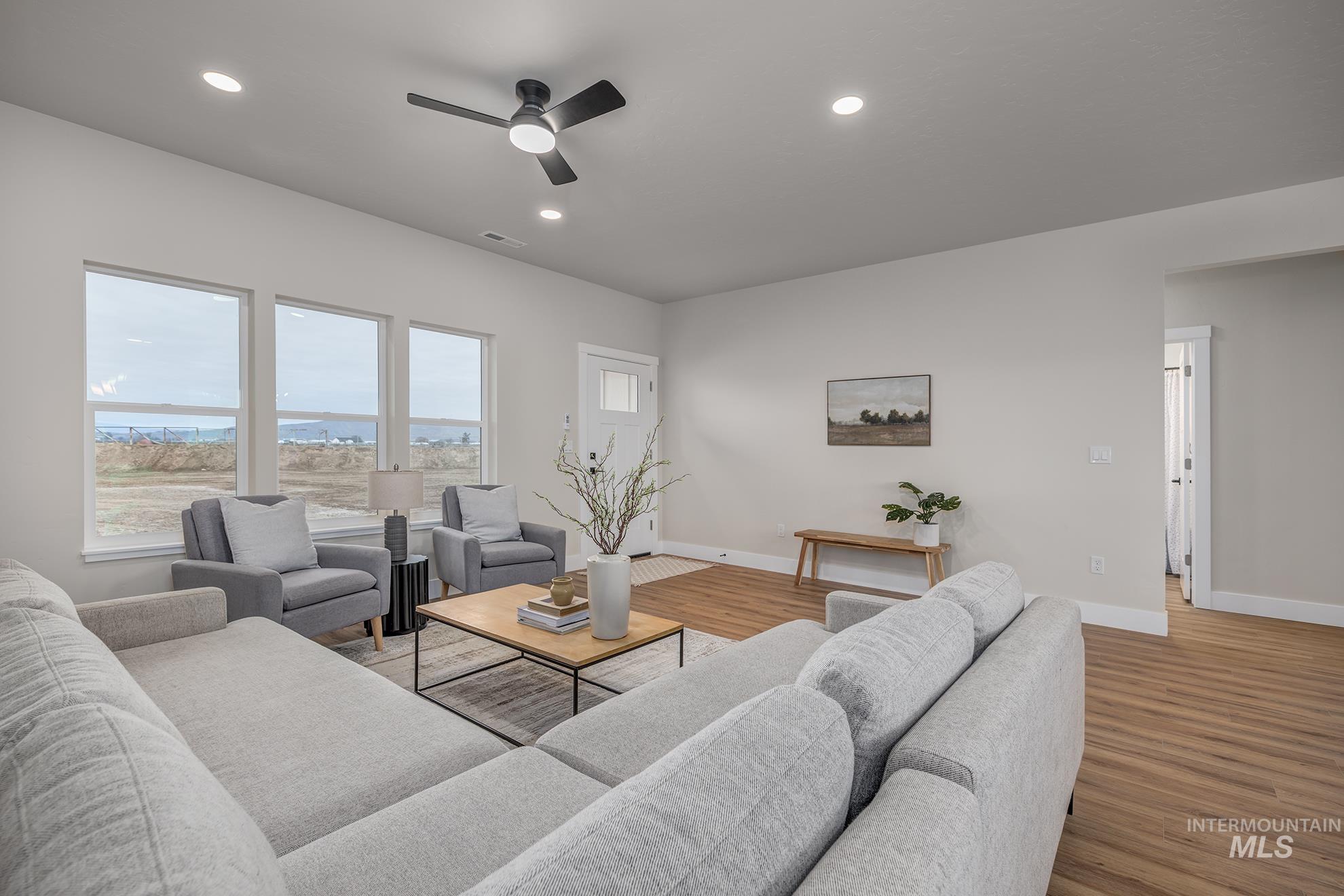 1367 Hansen Road Weiser, ID 83672 - Photo 3 of 36 Living area with a ceiling fan, light wood finished floors, and recessed lighting