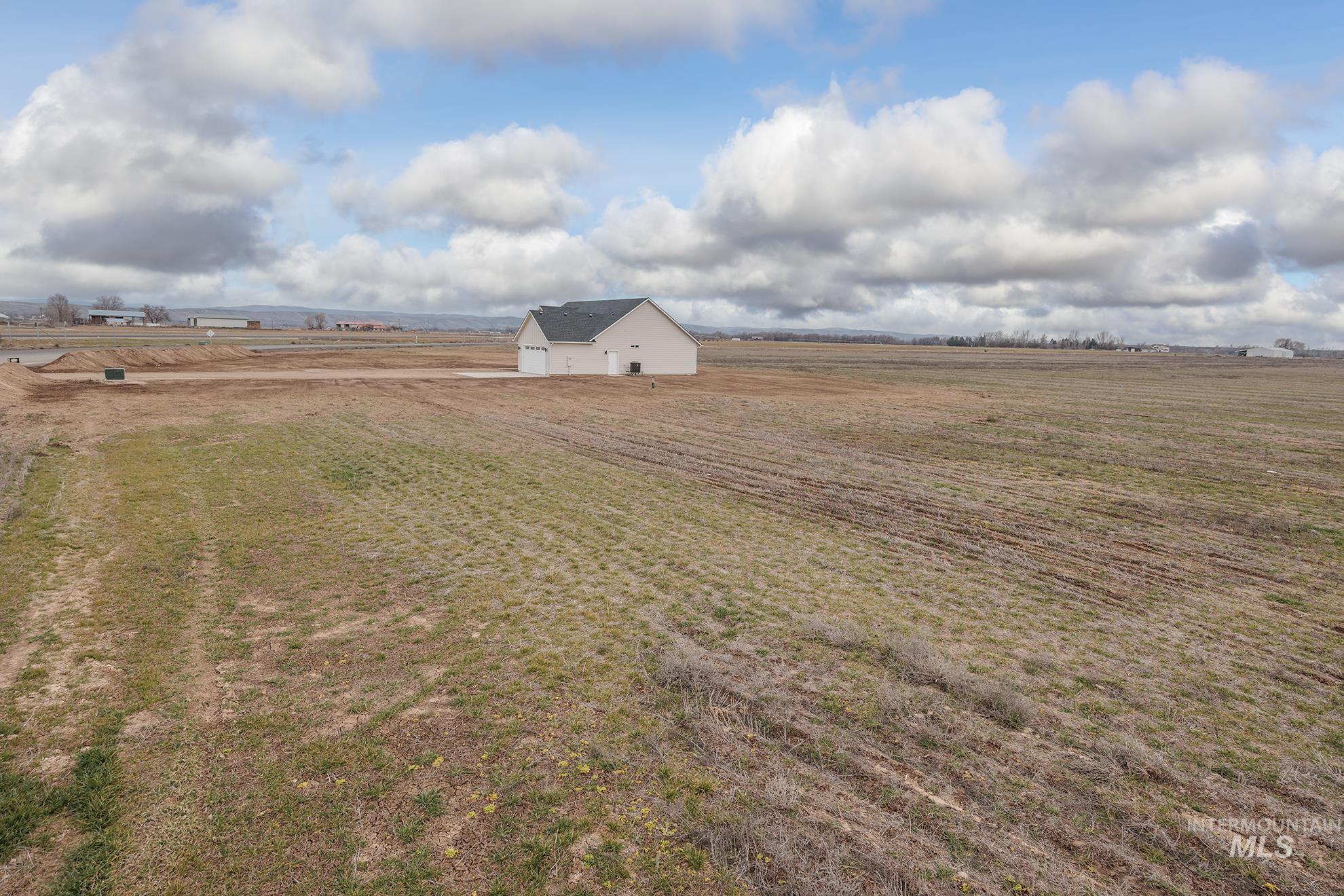 1367 Hansen Road Weiser, ID 83672 - Photo 31 of 36 View of grassy yard with a view of rural / pastoral area