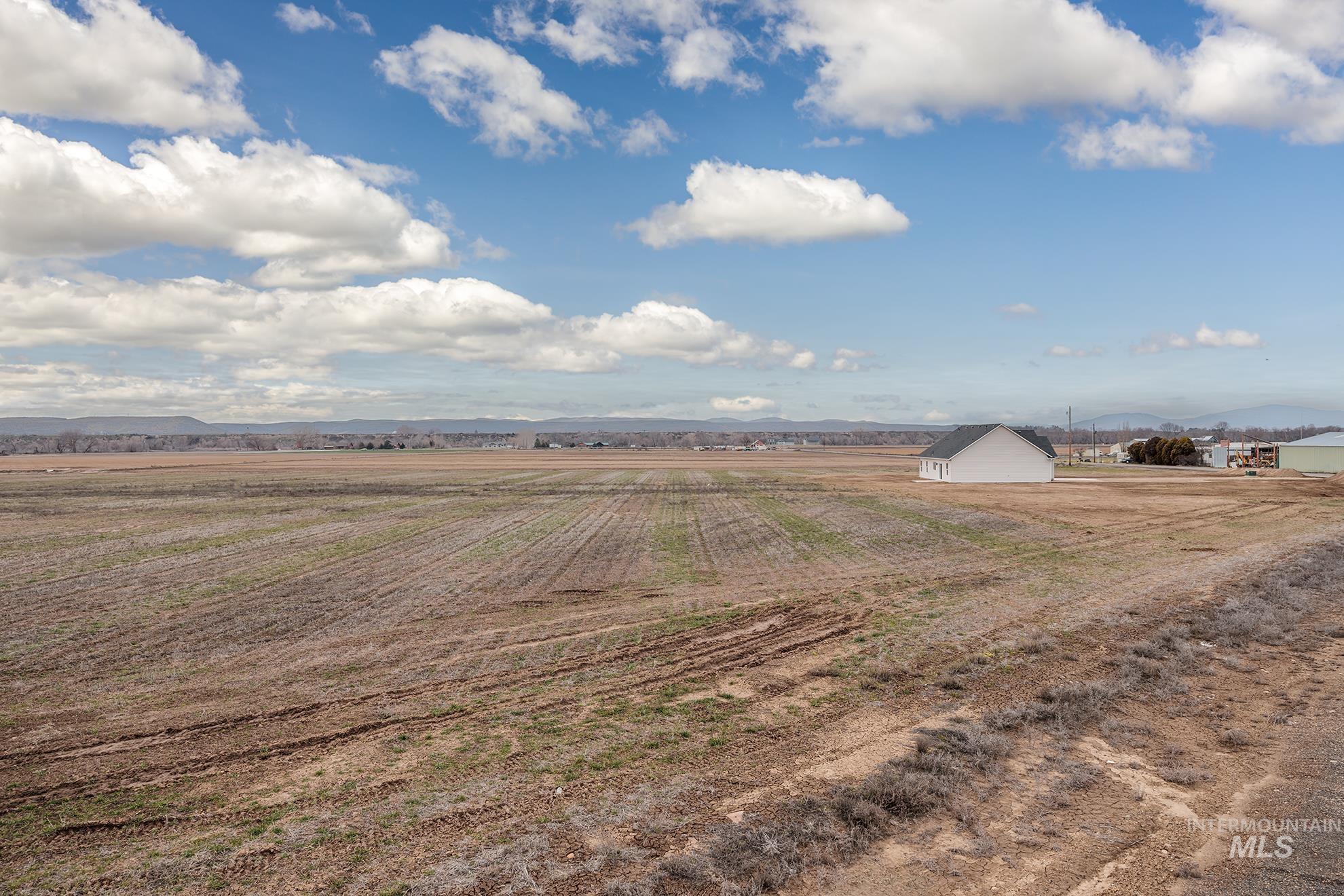 1367 Hansen Road Weiser, ID 83672 - Photo 32 of 36 View of yard with a mountain view, a rural view, and agricultural area