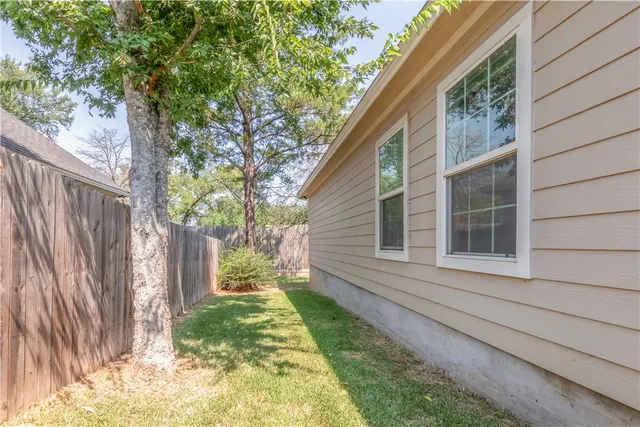 a backyard of a house with outdoor seating