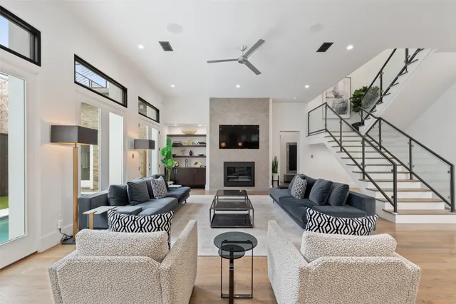 a living room with furniture and a painting on the wall