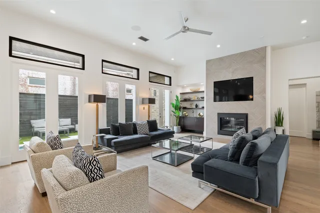 a living room with furniture a rug and a window