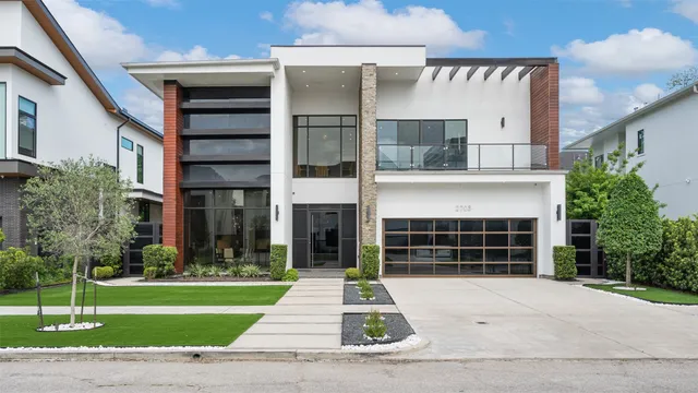 a view of two chairs in the balcony with wooden floor
