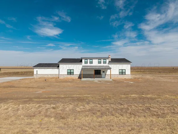 a view of house with ocean view