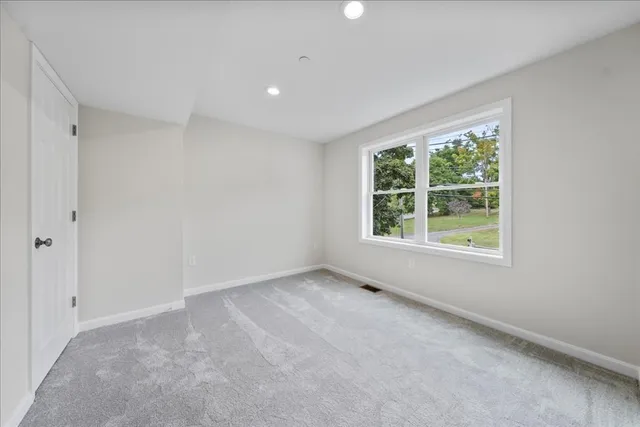 an empty room with windows and window