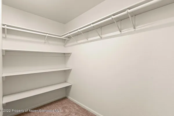 a view of an empty walk in closet