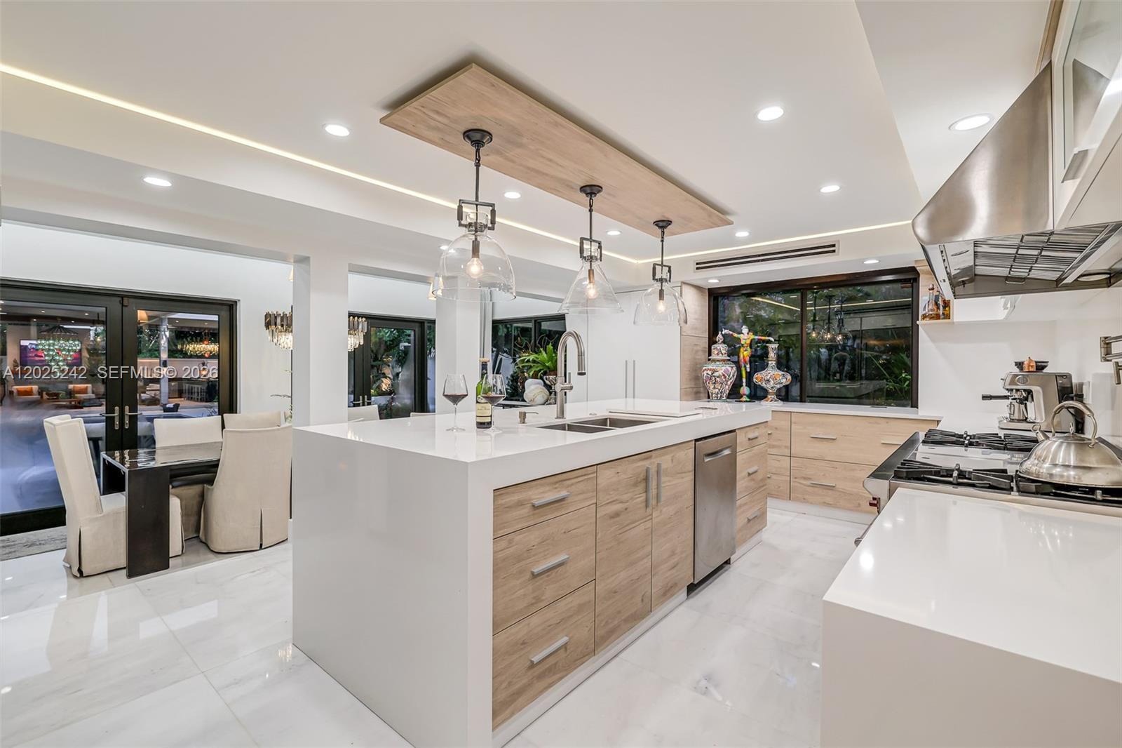 8761 Southwest 56th Street Miami, FL 33165 - Photo 26 of 90 a large kitchen with stainless steel appliances lots of counter space and a sink