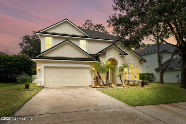 a kitchen with stainless steel appliances granite countertop a stove microwave and sink