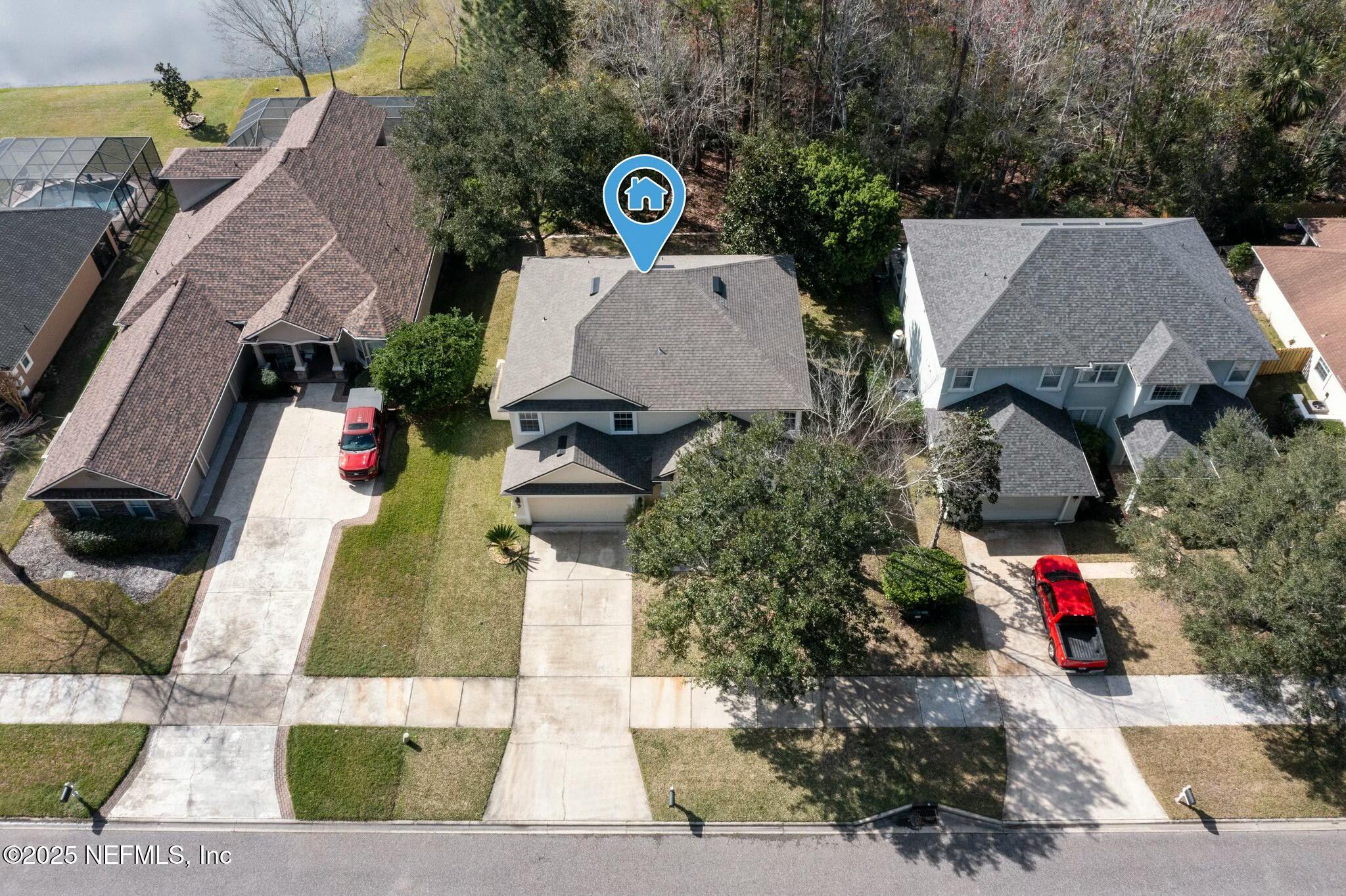 2448 Country Side Drive Fleming Island, FL 32003 - Photo 34 of 46 an aerial view of a house with a yard and a large tree